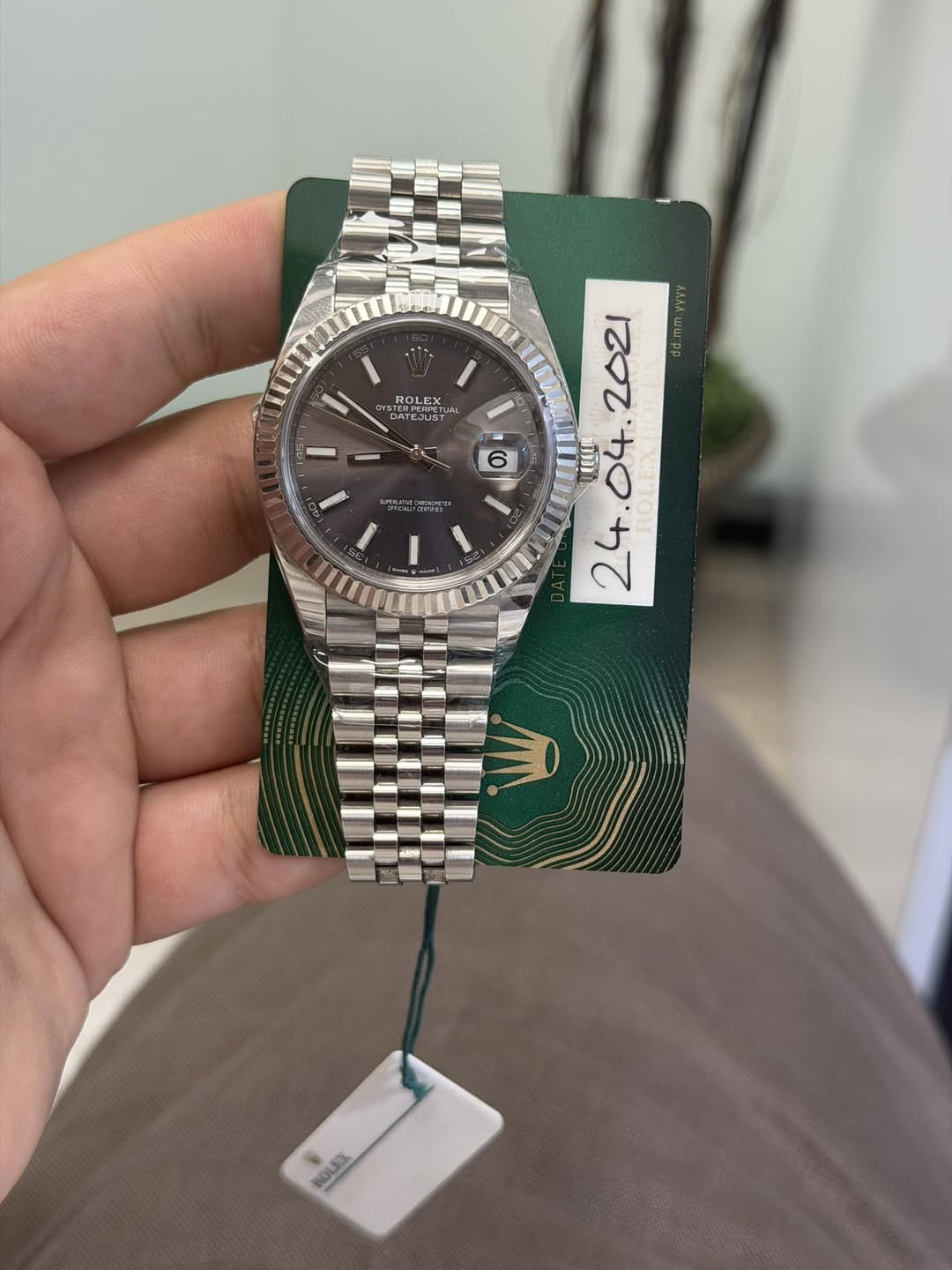 May be an image of wrist watch and text