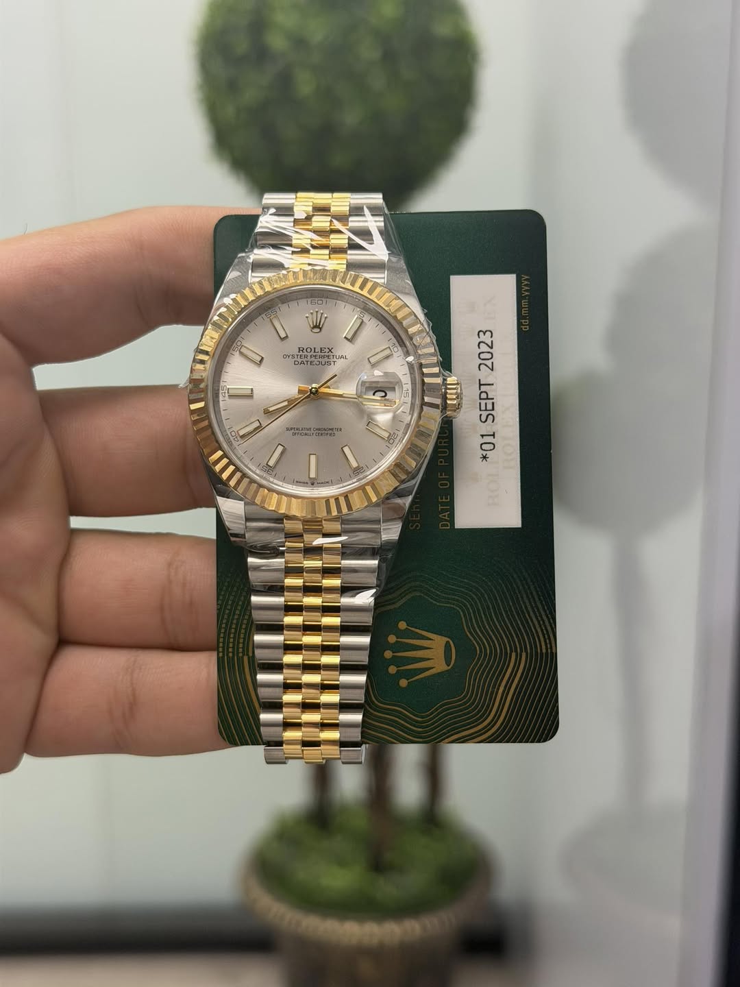 May be an image of wrist watch and text