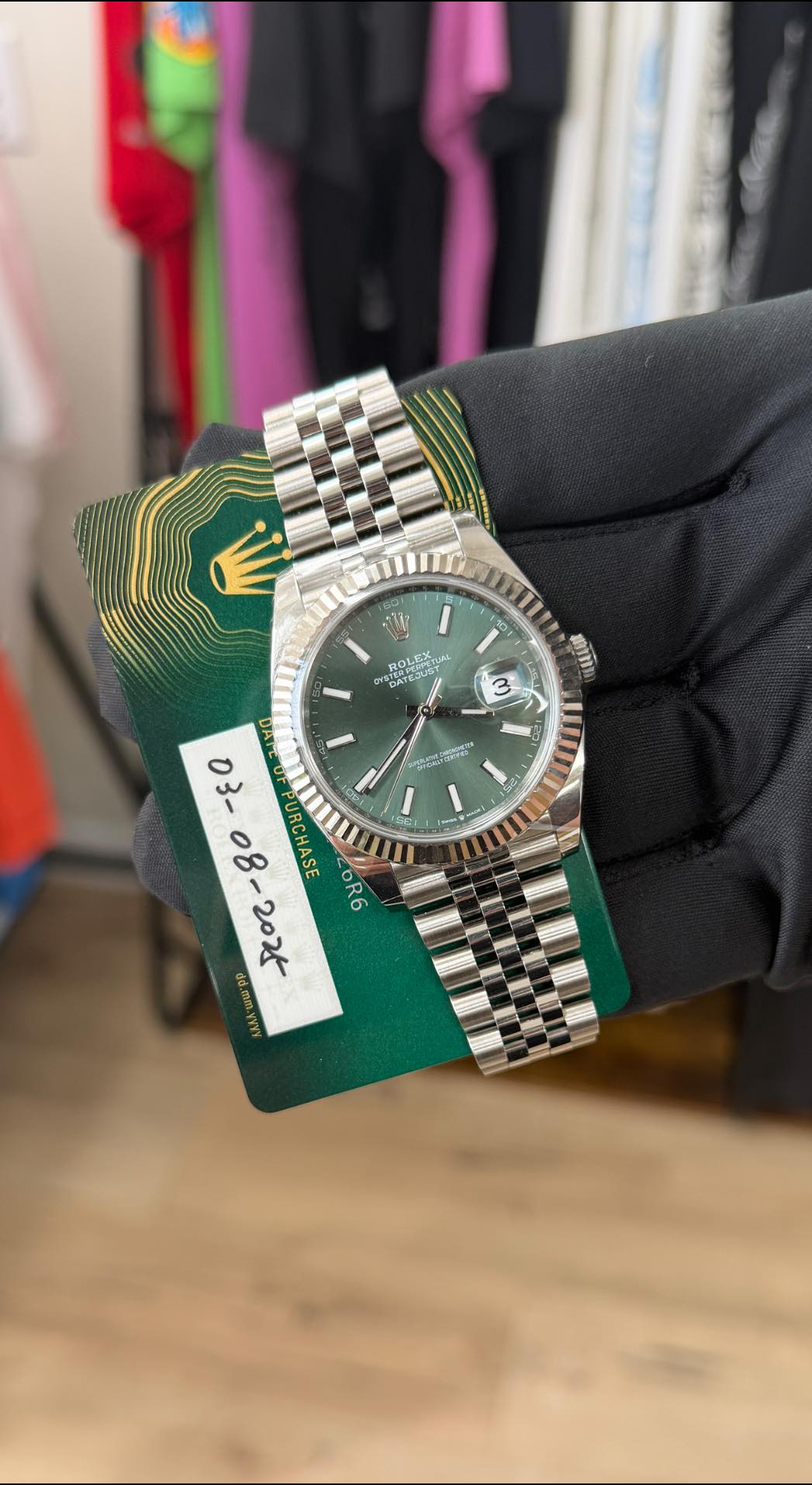 May be an image of wrist watch and text
