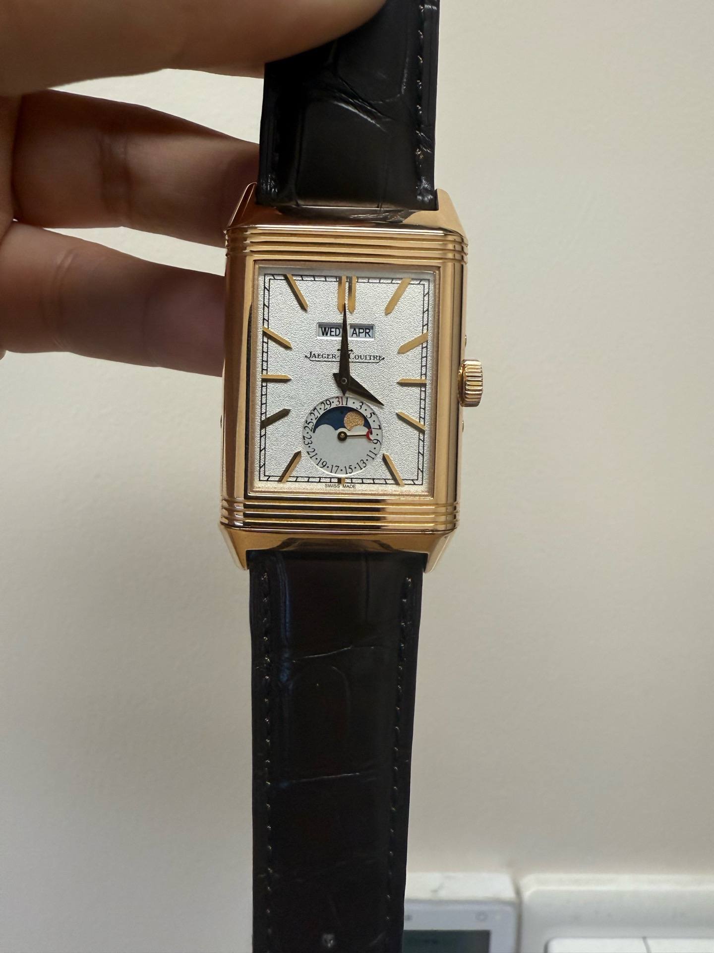 May be an image of wrist watch and text