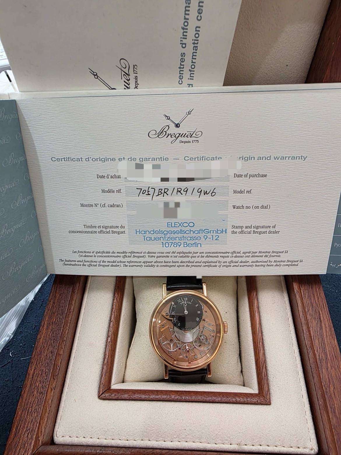 May be an image of wrist watch and text that says 'd'informa cen centres information uet Jepuis 1775 Bregueto 775 Depiés| Certificat d'origine et de garantie Dated'achai- 'achal…