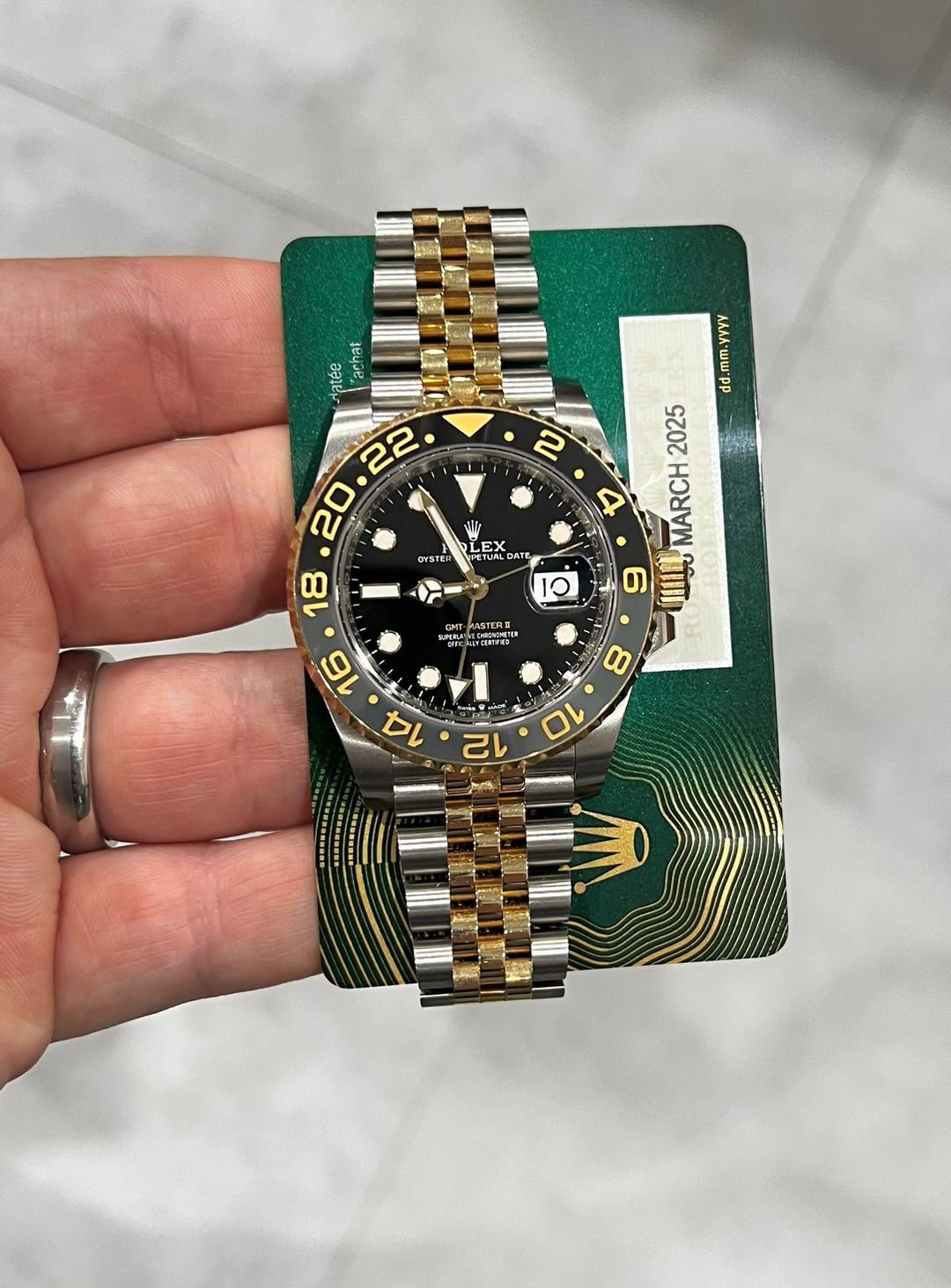 May be an image of wrist watch and text