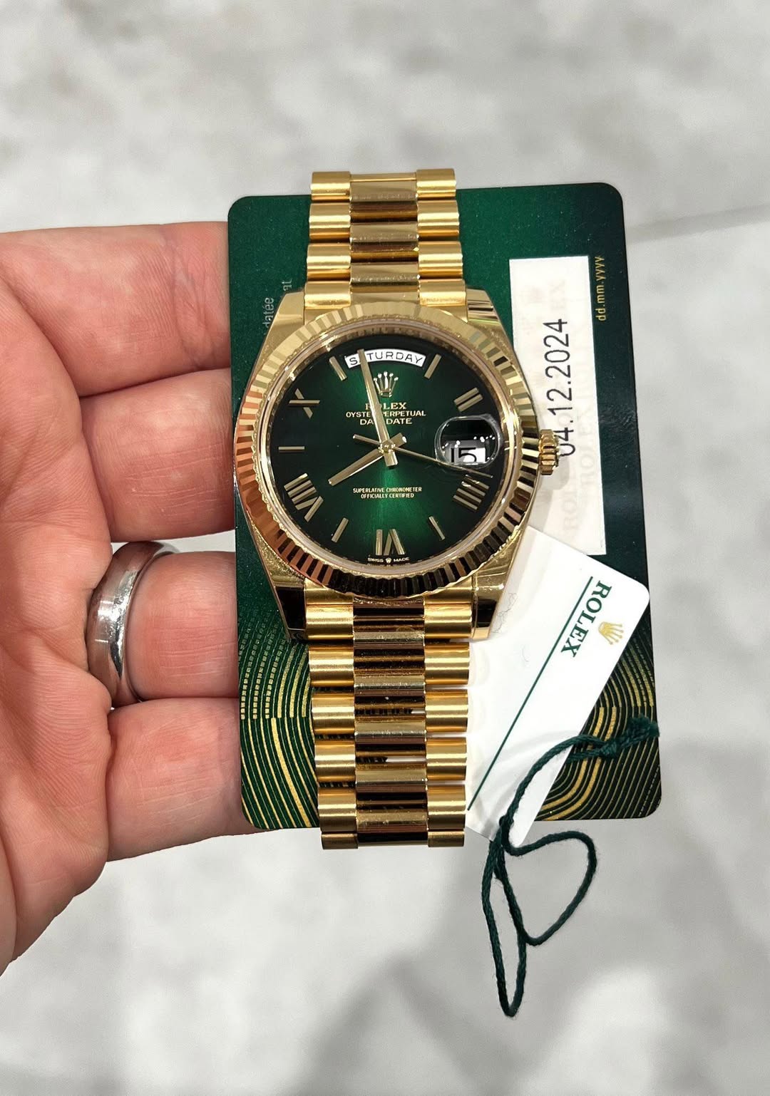 May be an image of wrist watch and text