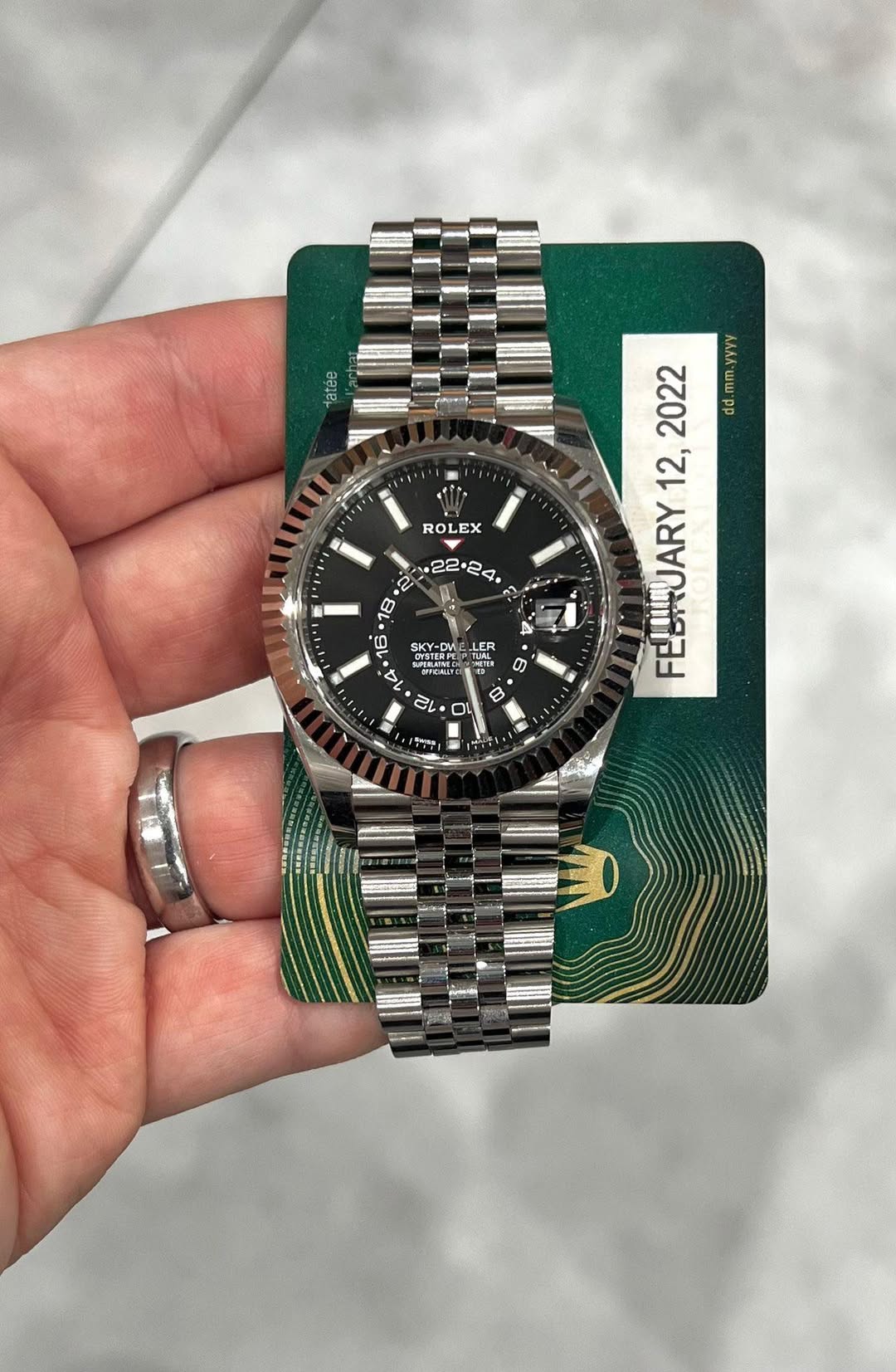 May be an image of wrist watch and text