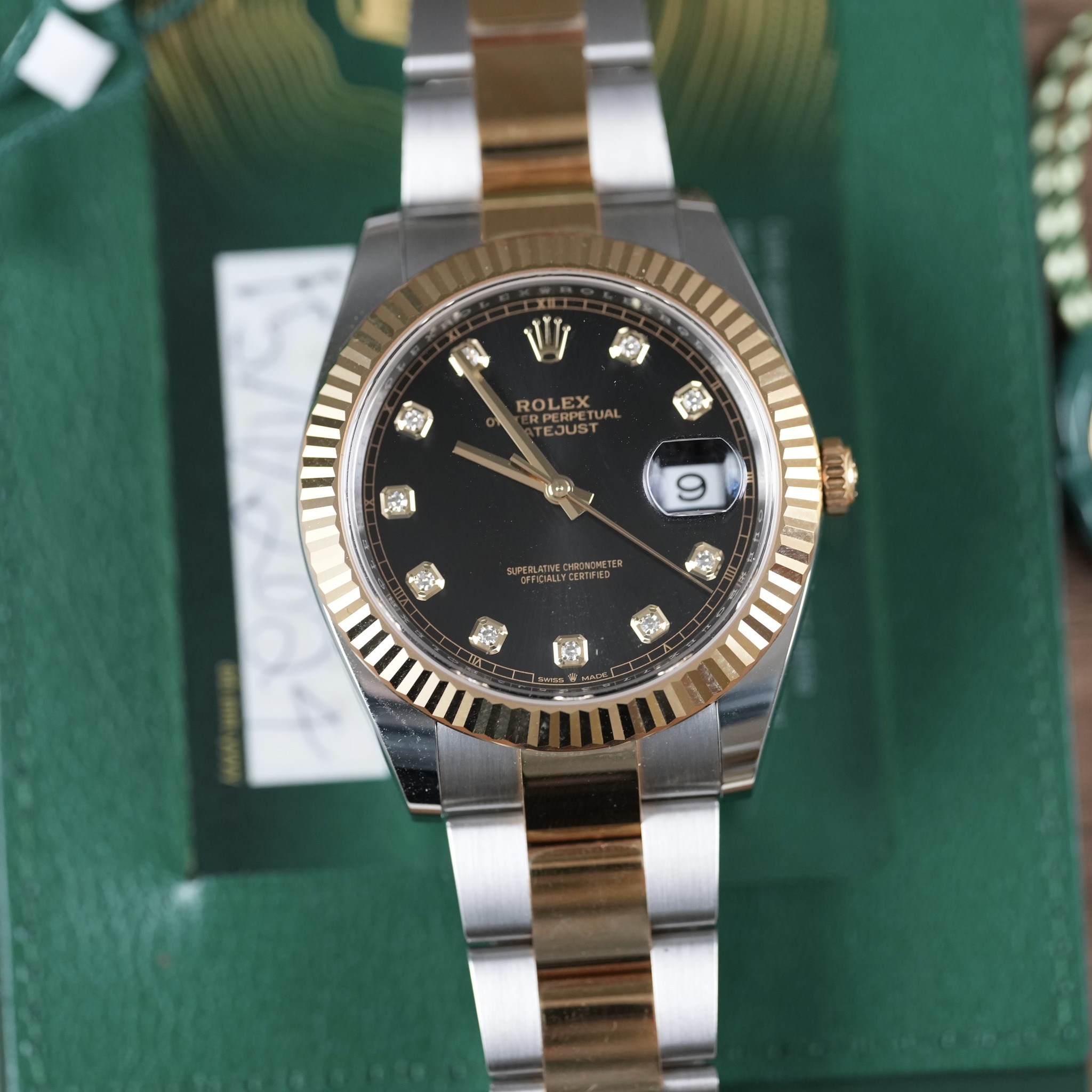 May be an image of wrist watch and text