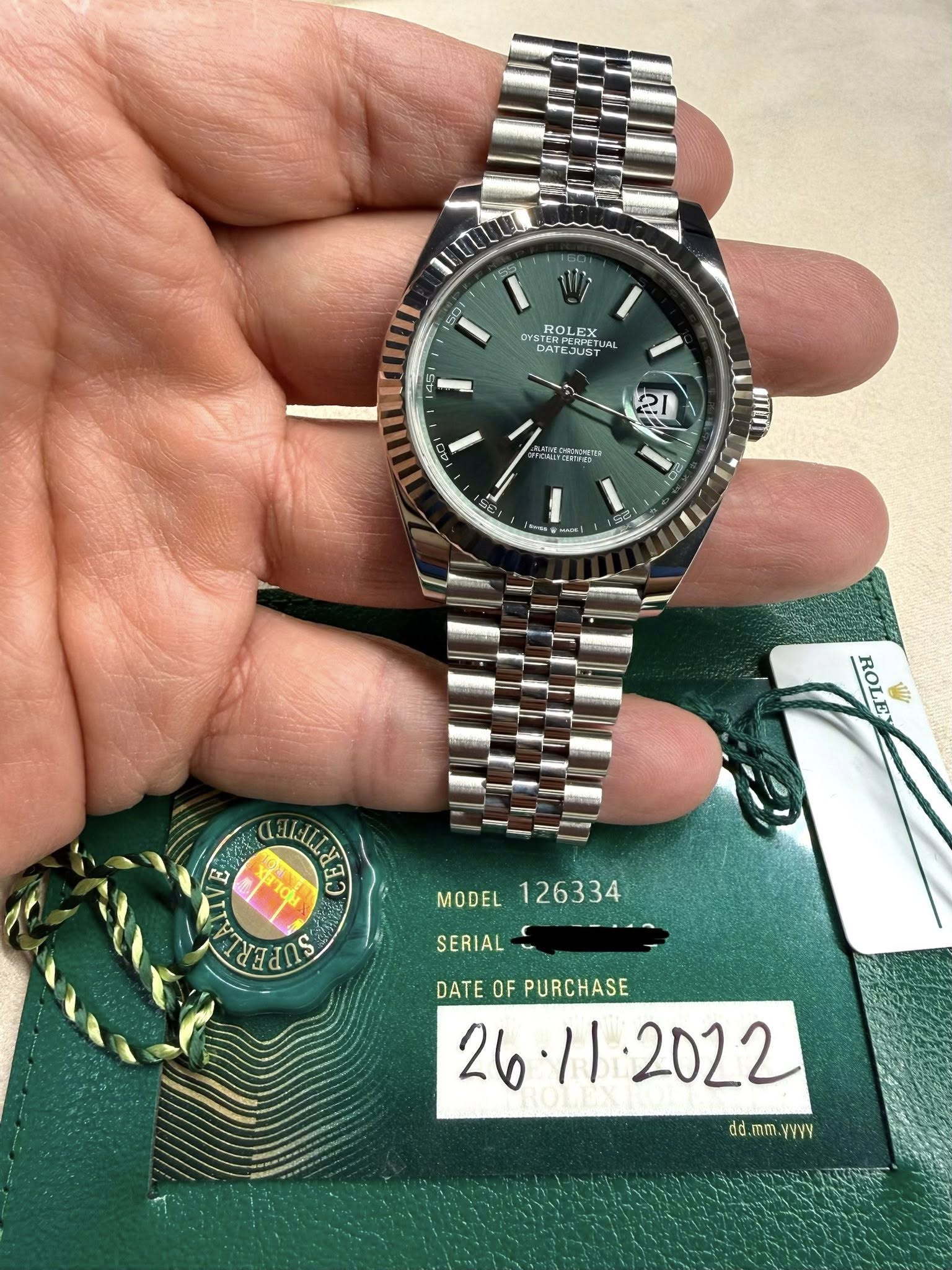 May be an image of wrist watch and text that says '7ו1 OYSTER DA DATI ROLEX DATEJUST TUA DATES اهد 21 HO TPER UIL 1 Kme 1I ROLE ந MODEL 126334 SSLUS SERIAL- DATE OF PURCHASE…
