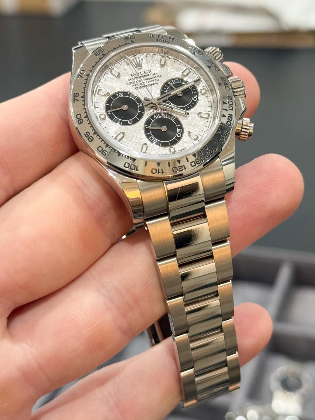 May be an image of wrist watch and text