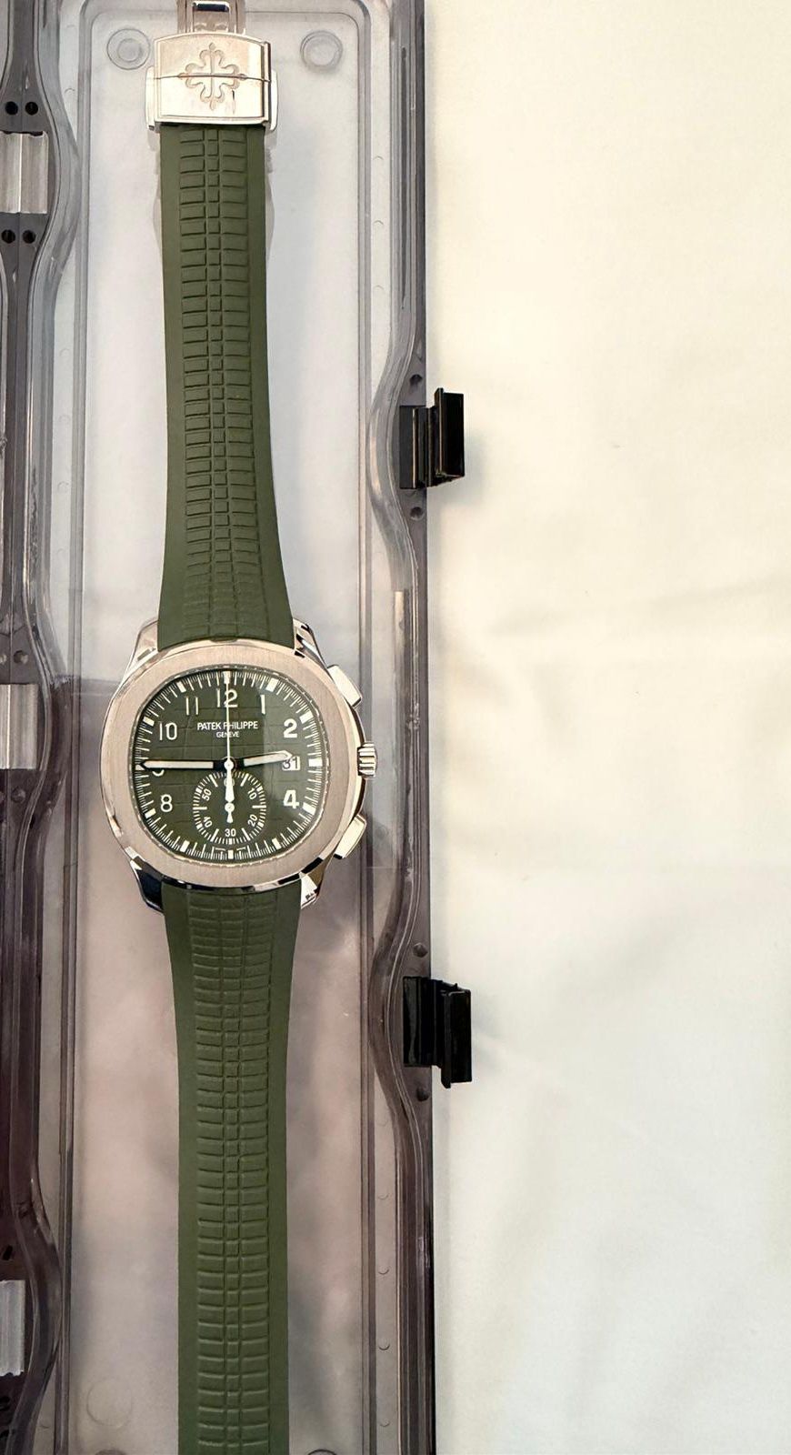 May be an image of wrist watch and text