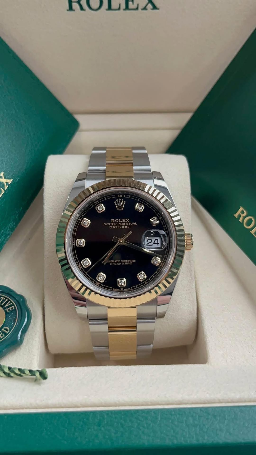May be an image of wrist watch and text