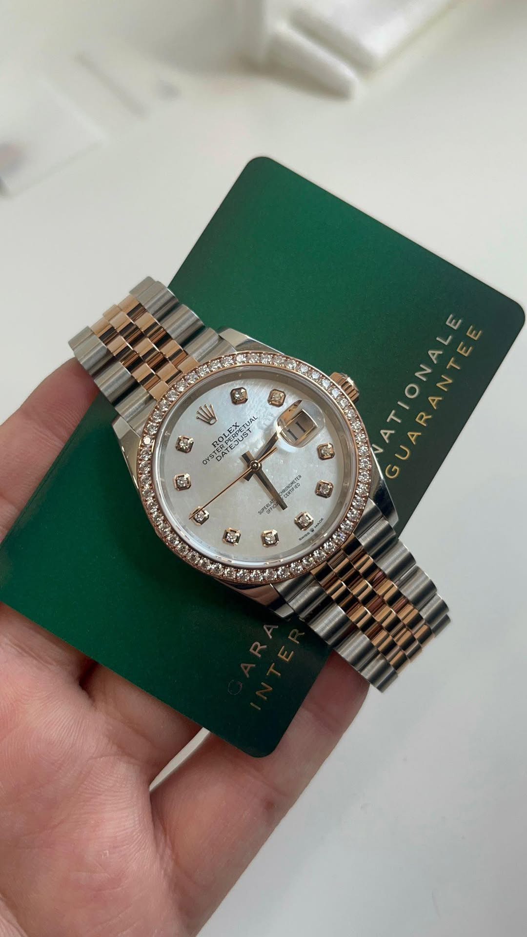 May be an image of wrist watch and text