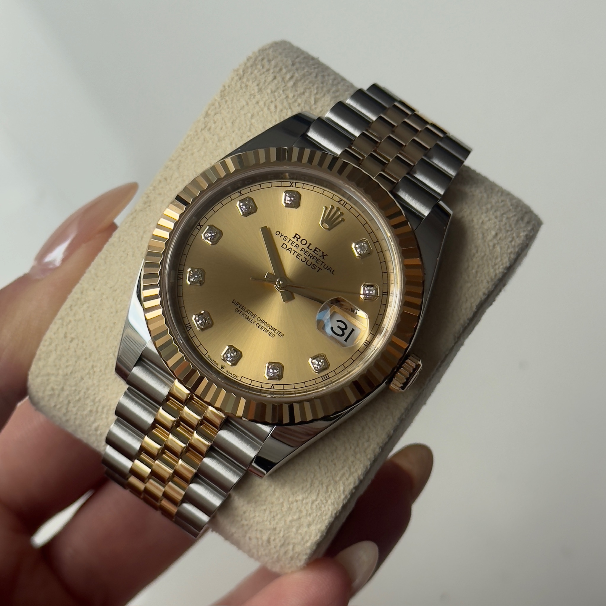 May be an image of wrist watch and text
