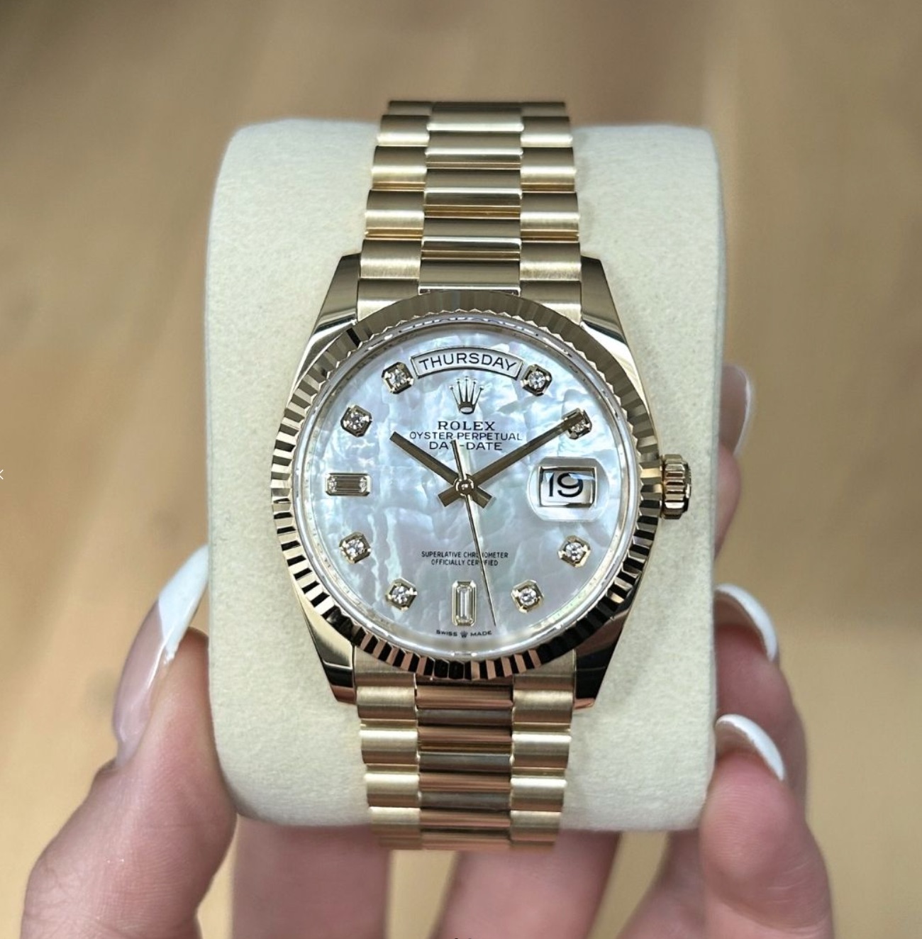 May be an image of wrist watch and text