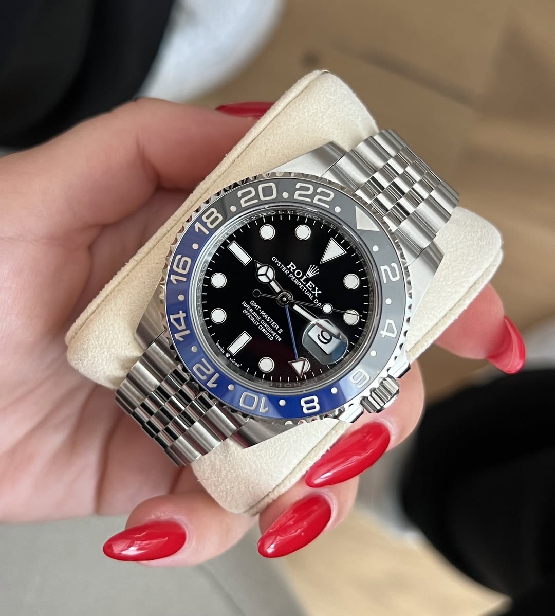 May be an image of wrist watch and text