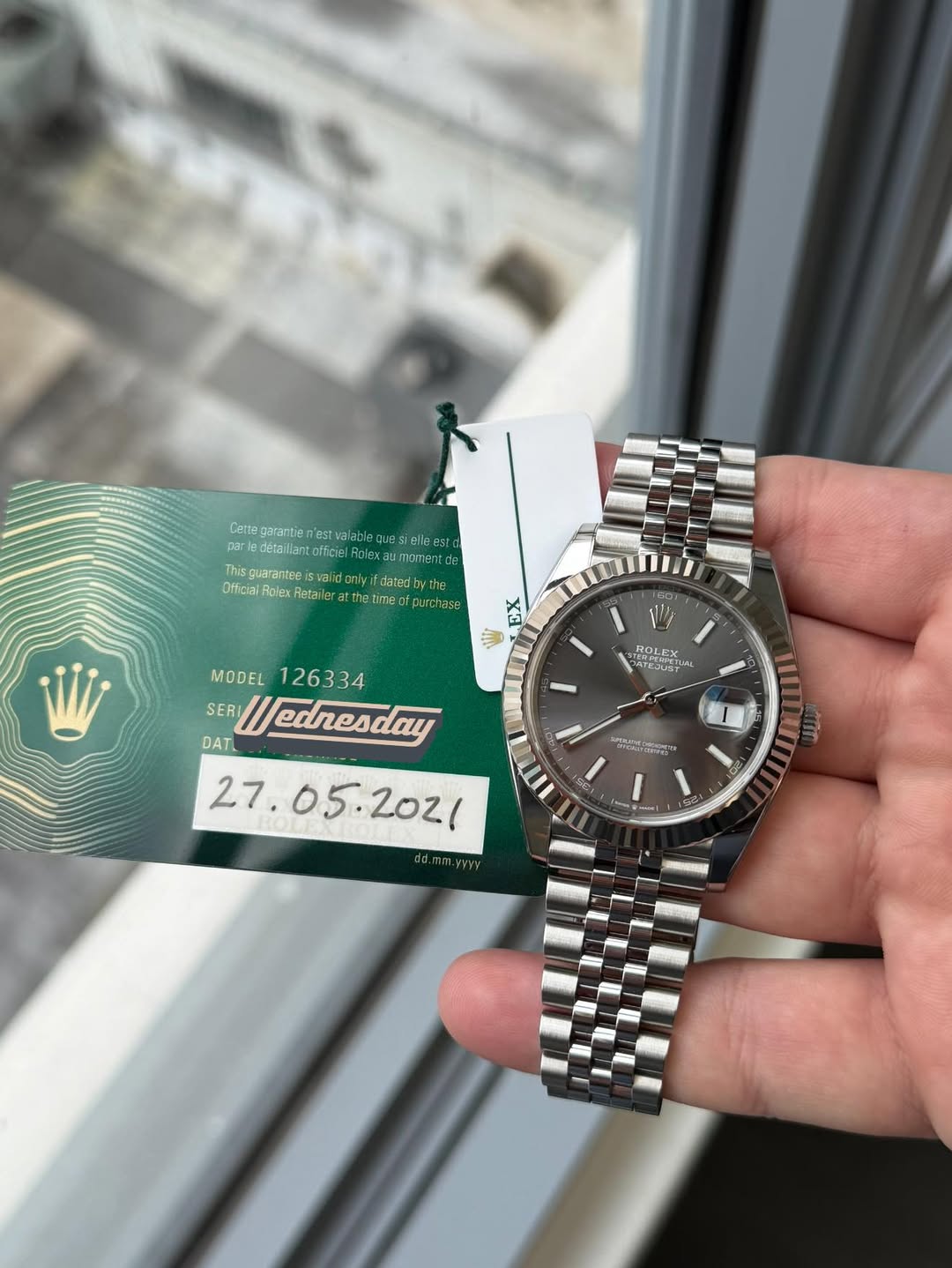 May be an image of wrist watch and text