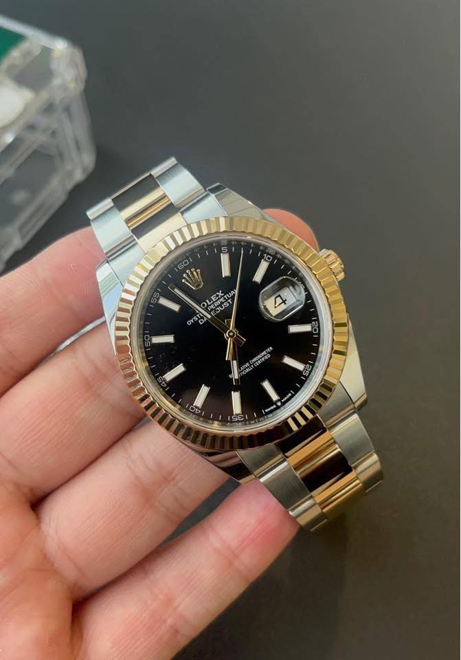 May be an image of wrist watch and text