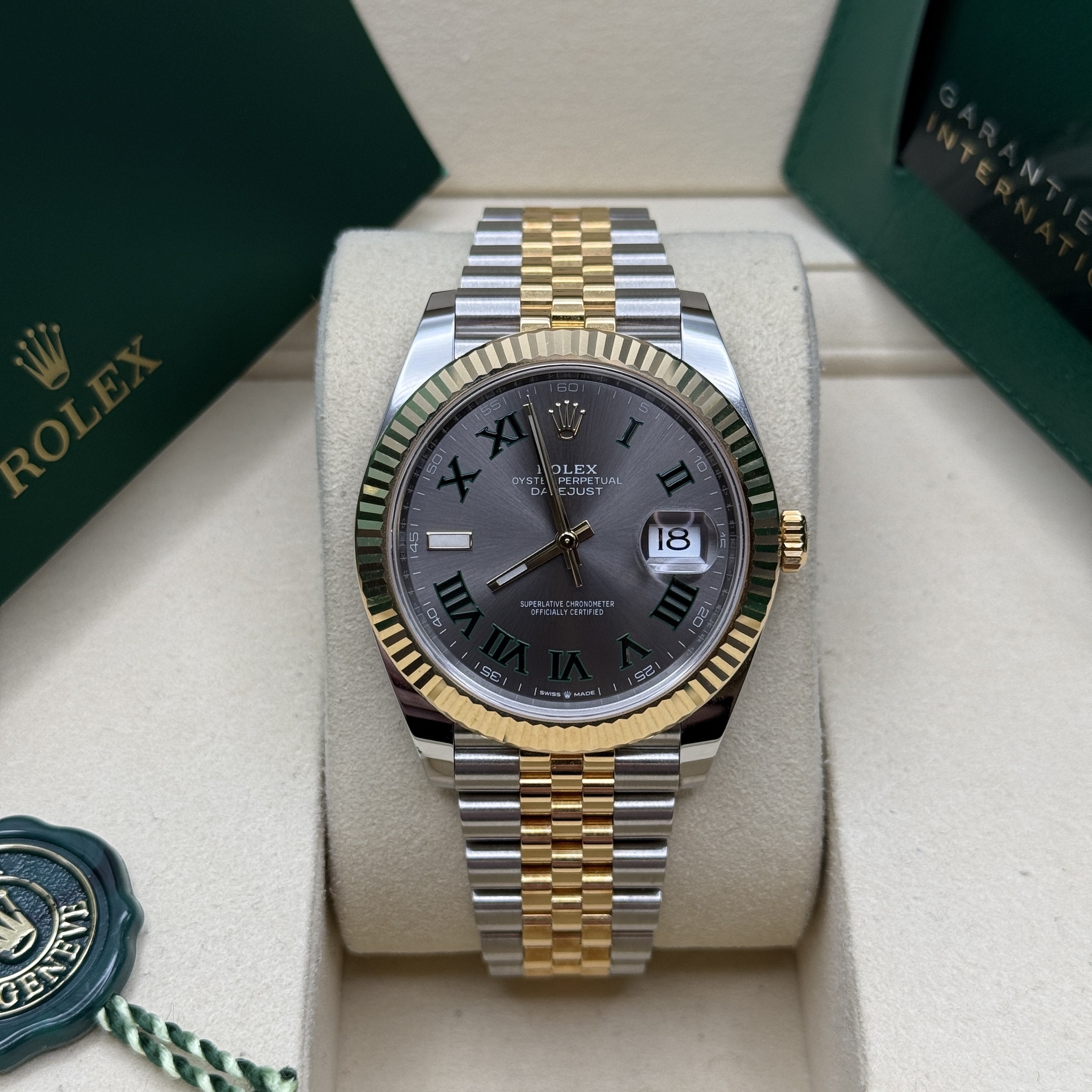 May be an image of wrist watch and text