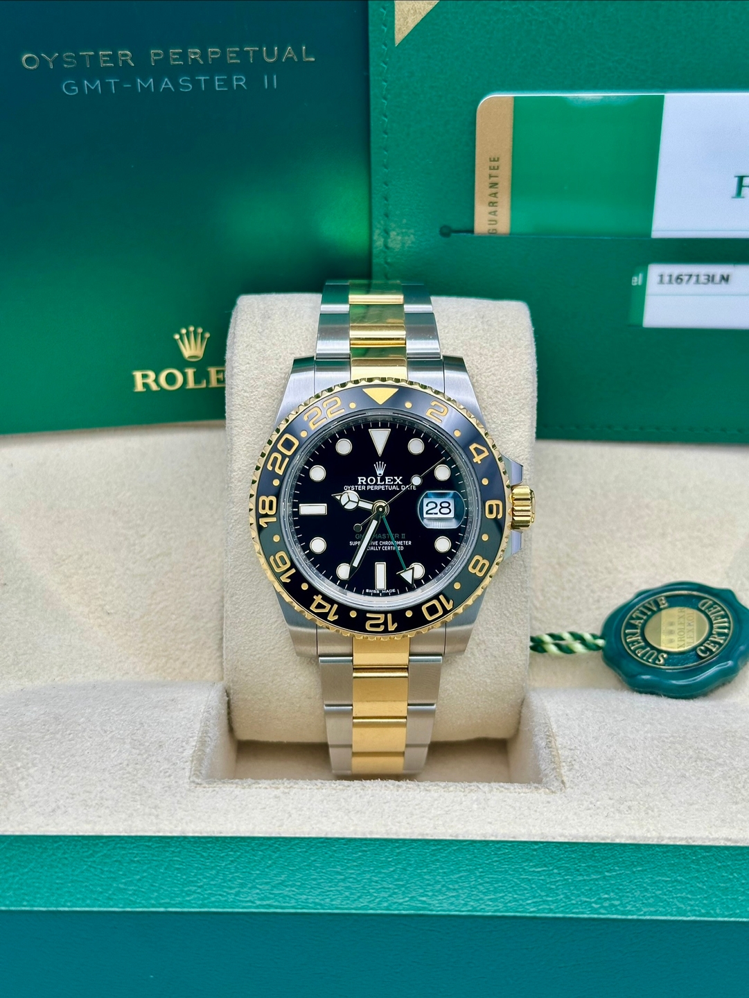 May be an image of wrist watch and text that says 'OYSTER OYSTERPERPETUAL PERPETUAL GMT-MASTER GMT-MASTERII 11 GUARANTEE F al 116713LN ROLE 2 ROLEX 2E ROLTN 28 4 6 ITII MTcи 8 10…