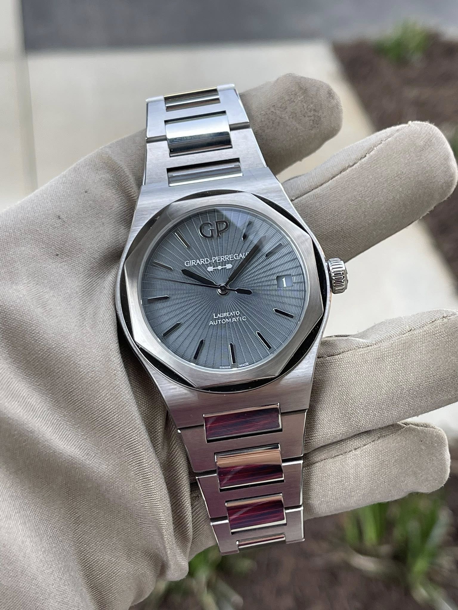 May be an image of wrist watch and text