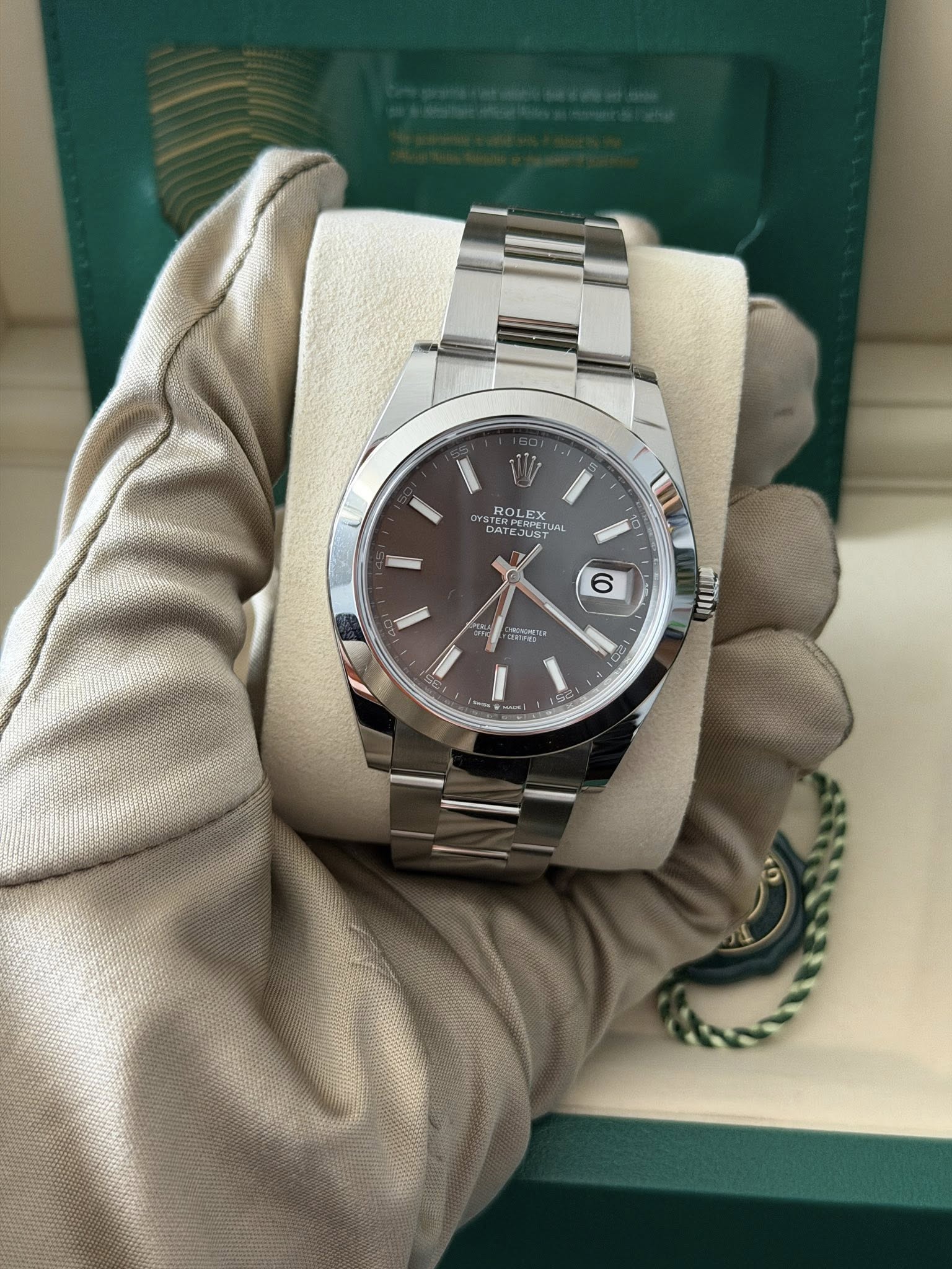 May be an image of wrist watch and text