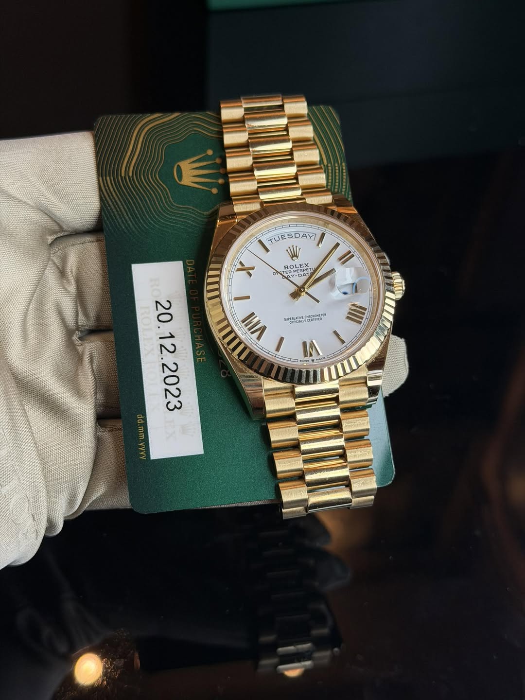 May be an image of wrist watch and text