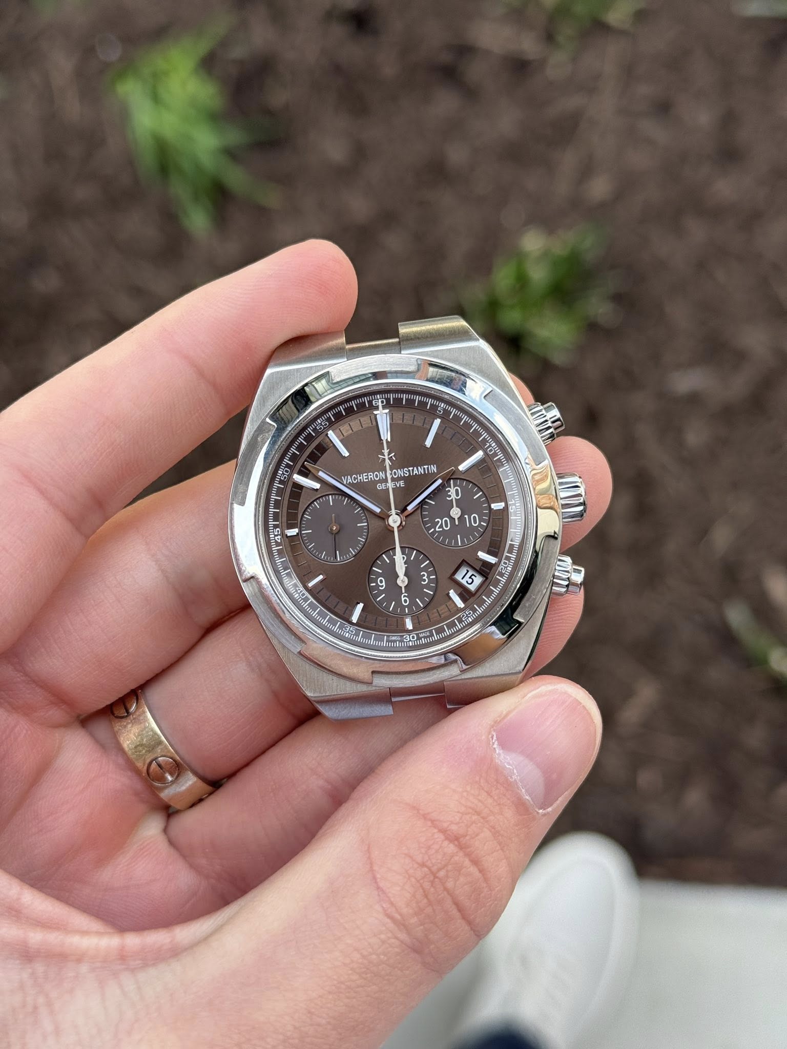 May be an image of wrist watch and text