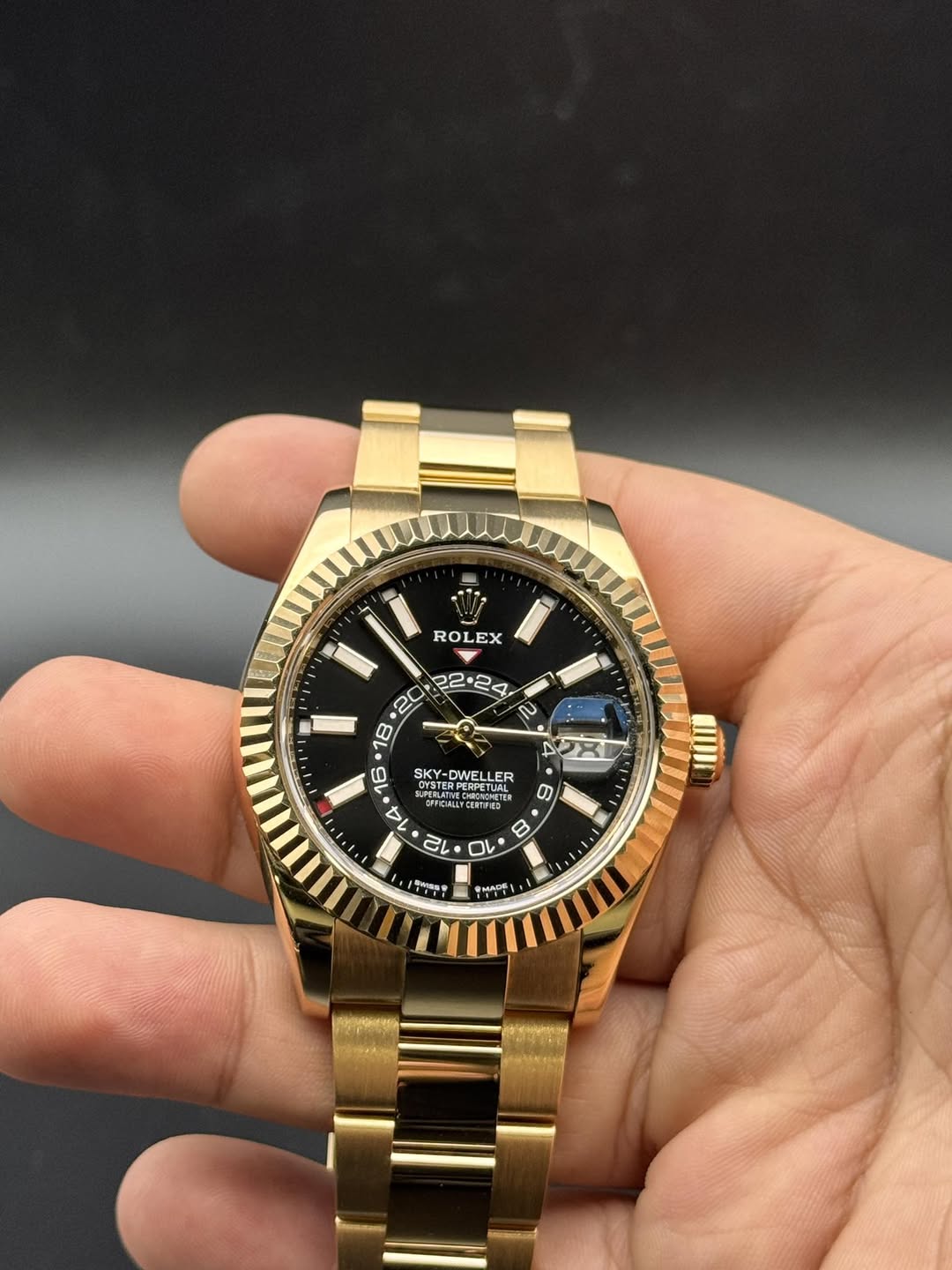 May be an image of wrist watch and text