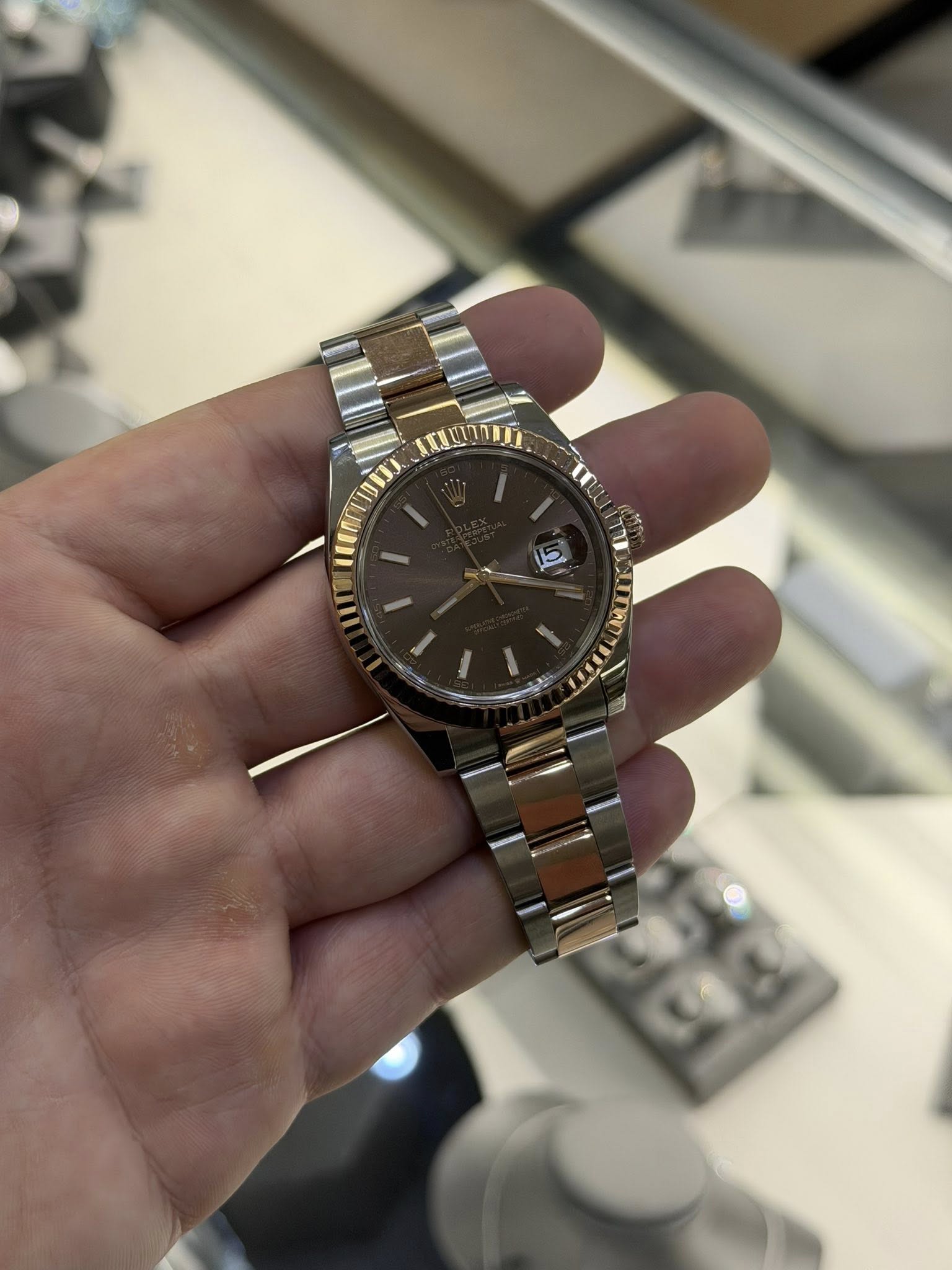 May be an image of wrist watch and text