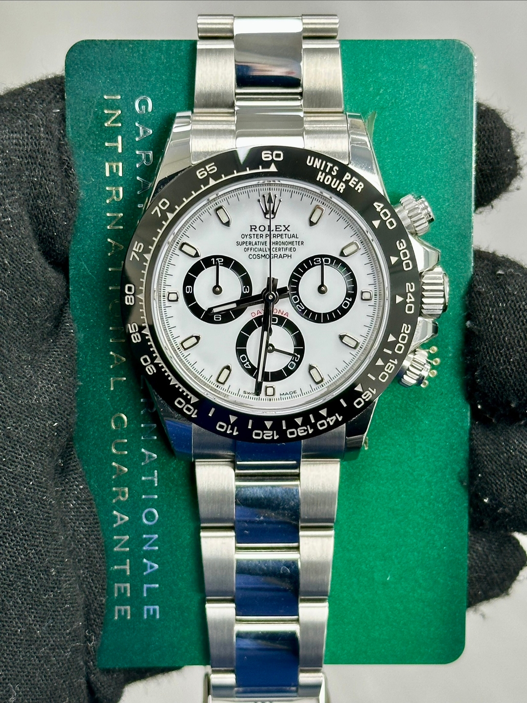 May be an image of wrist watch and text that says '60 65 !VELNE GARA 70 75 ROI EX REDLETAEE RUATNEHPON MEOMONETEP PETUAL 1ዬ COSMO COSMOGRAPH GRAPH 9 0 G 6 o)) DN OA EIEAUDS UNITS…