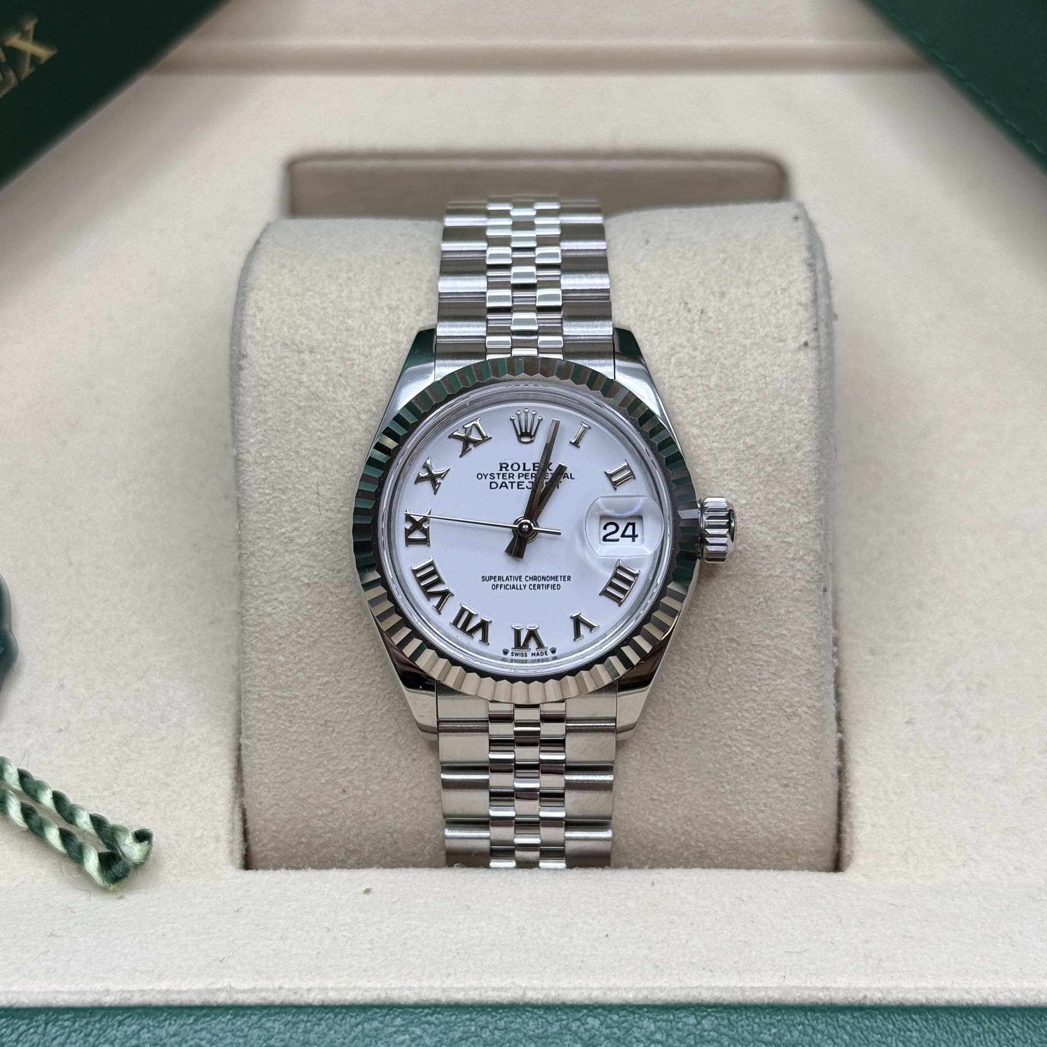 May be an image of wrist watch and text