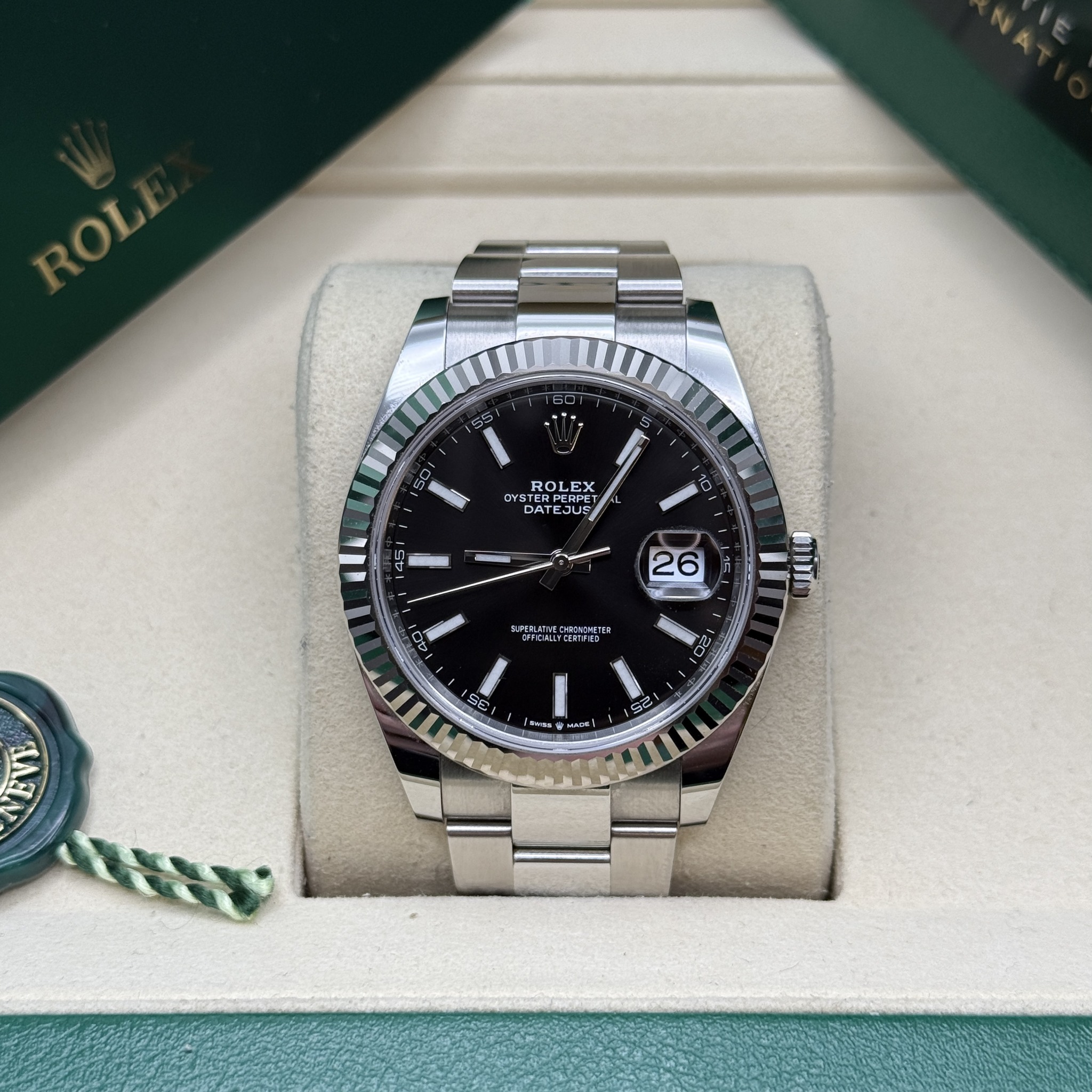 May be an image of wrist watch and text