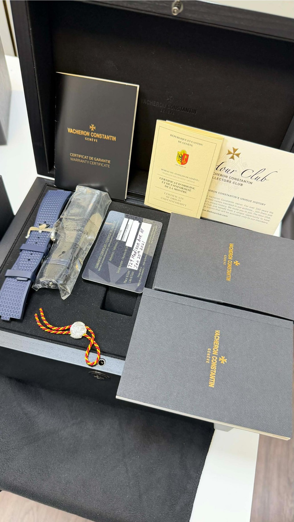 May be an image of cufflinks, wrist watch and text