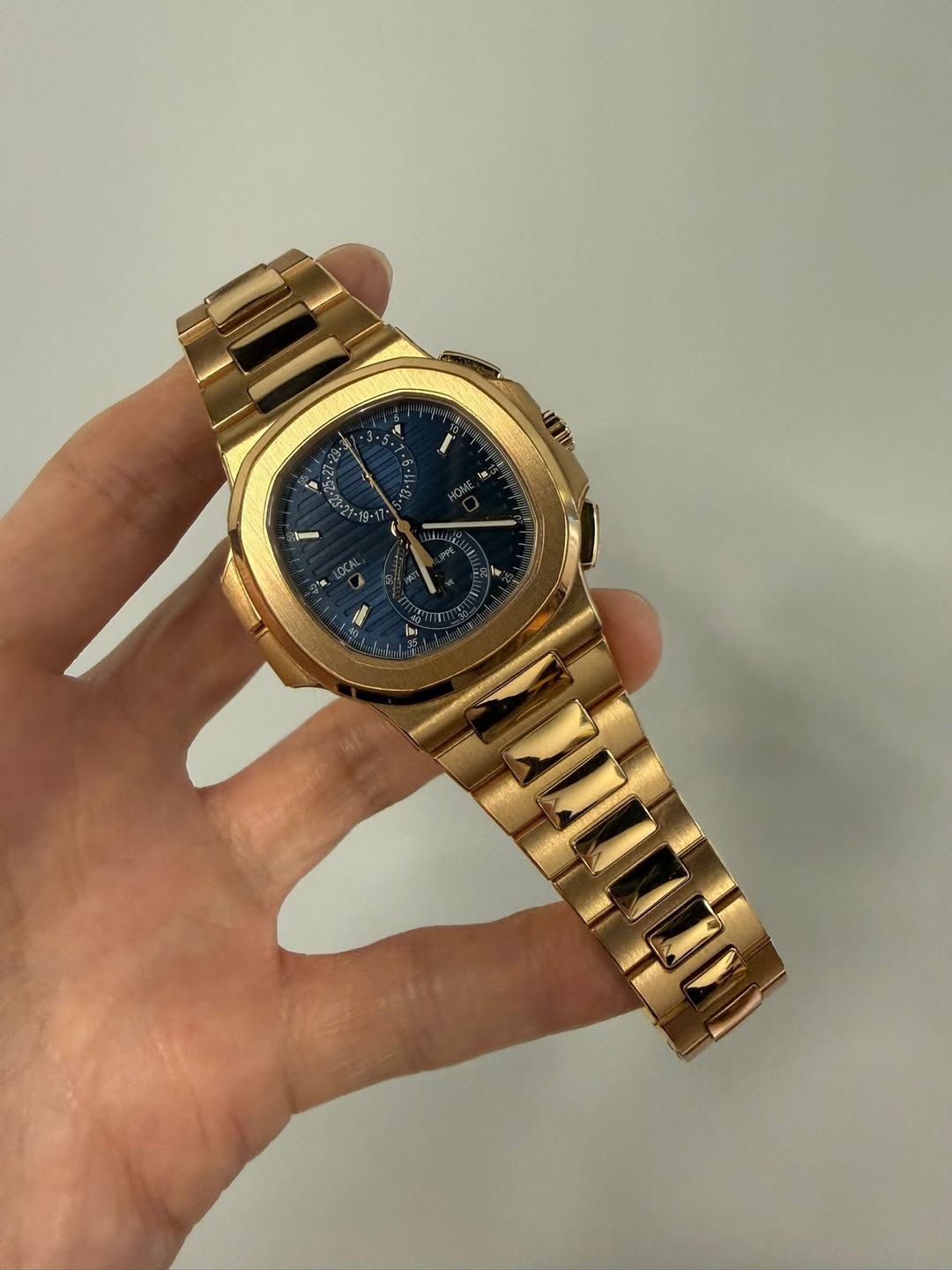 May be an image of wrist watch and text