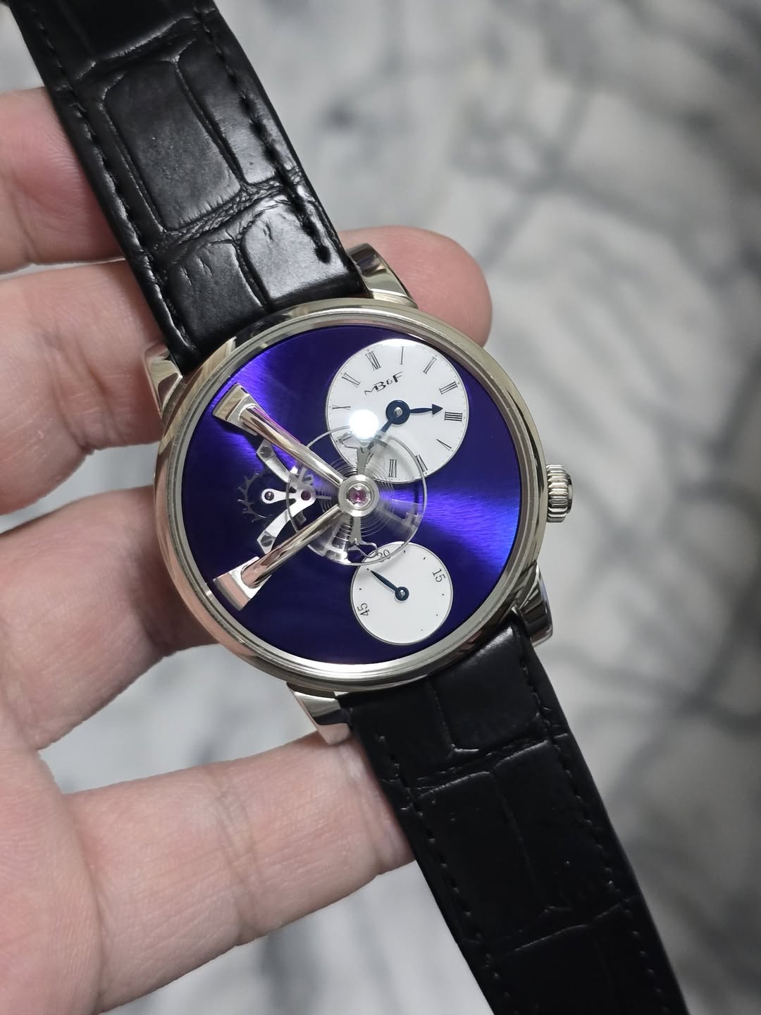 May be an image of wrist watch and text