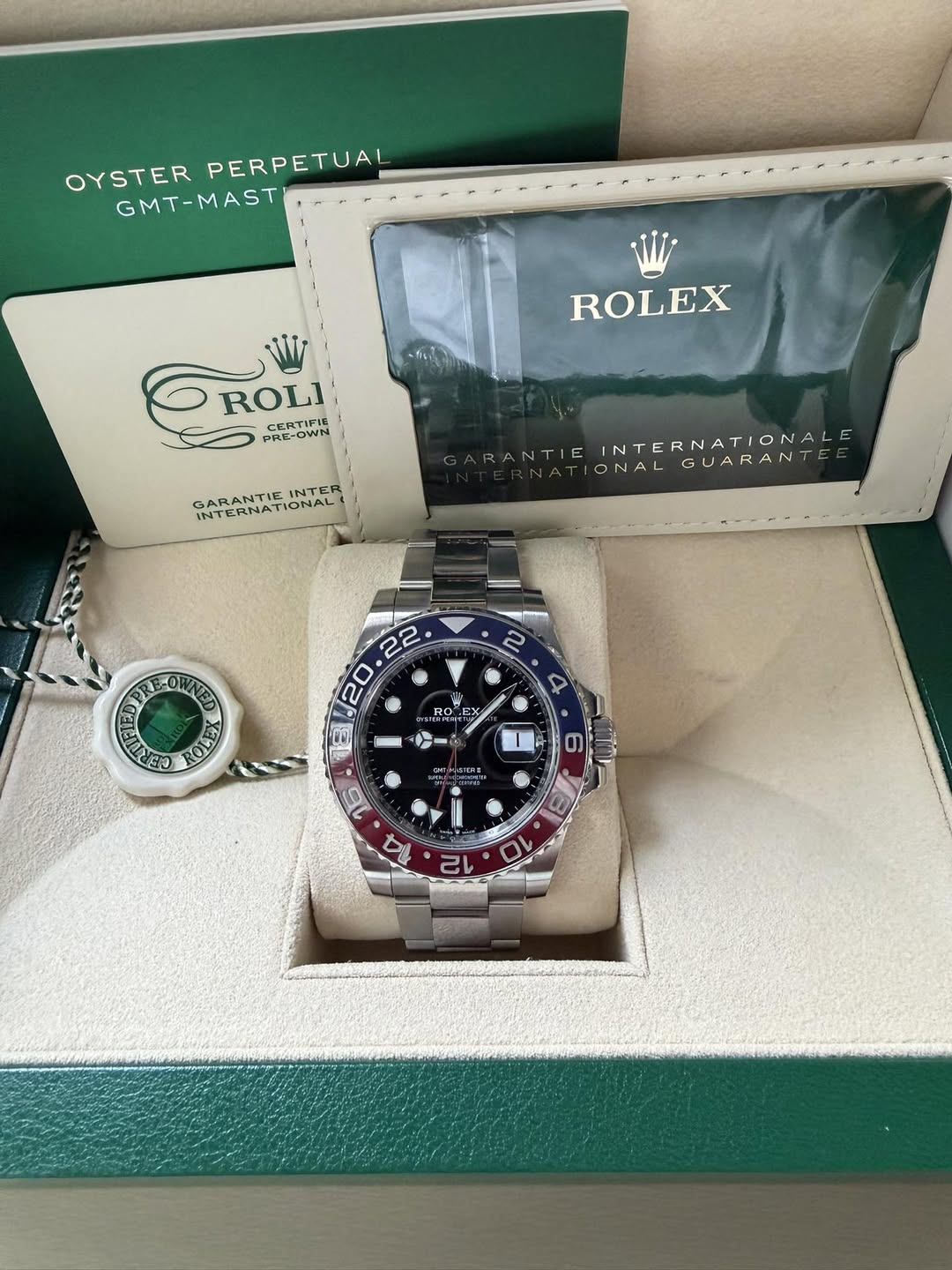 May be an image of wrist watch and text that says 'OYSTER PERPETUAL GMT-MAST Wj ROLEX ROLI -CERTIFI6 OROLI CELOWN -OWN PRE- GARANTIE INTER GARA INTERNATIONA! GARANTIEINTER NATIONAL…