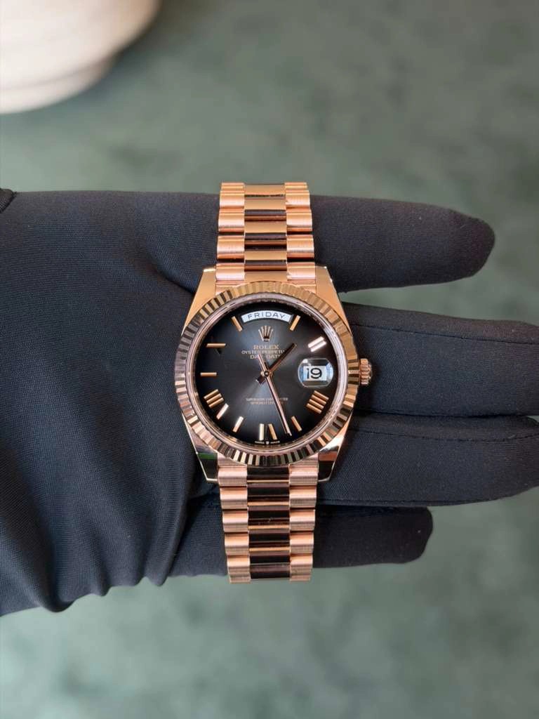 May be an image of wrist watch and text