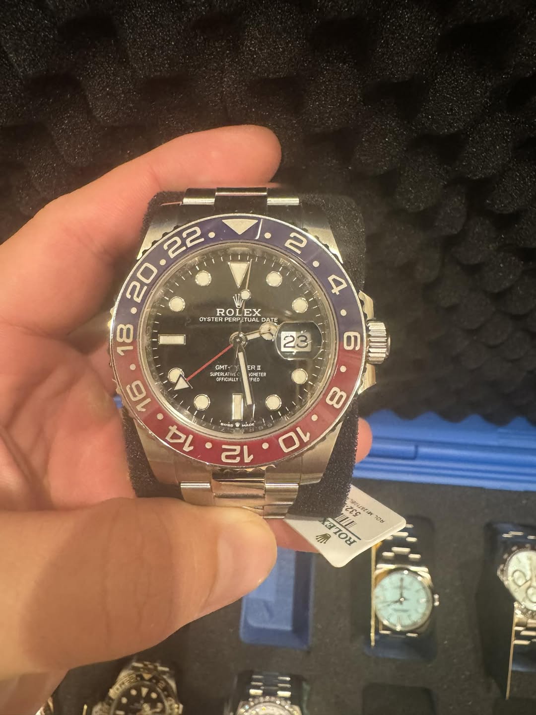 May be an image of wrist watch and text