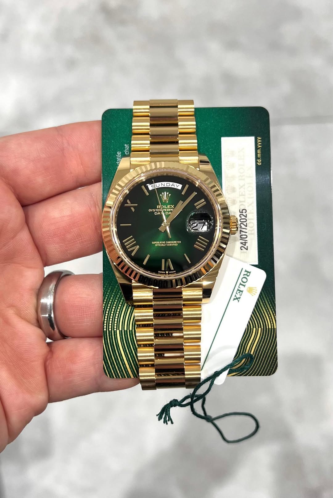 May be an image of wrist watch and text