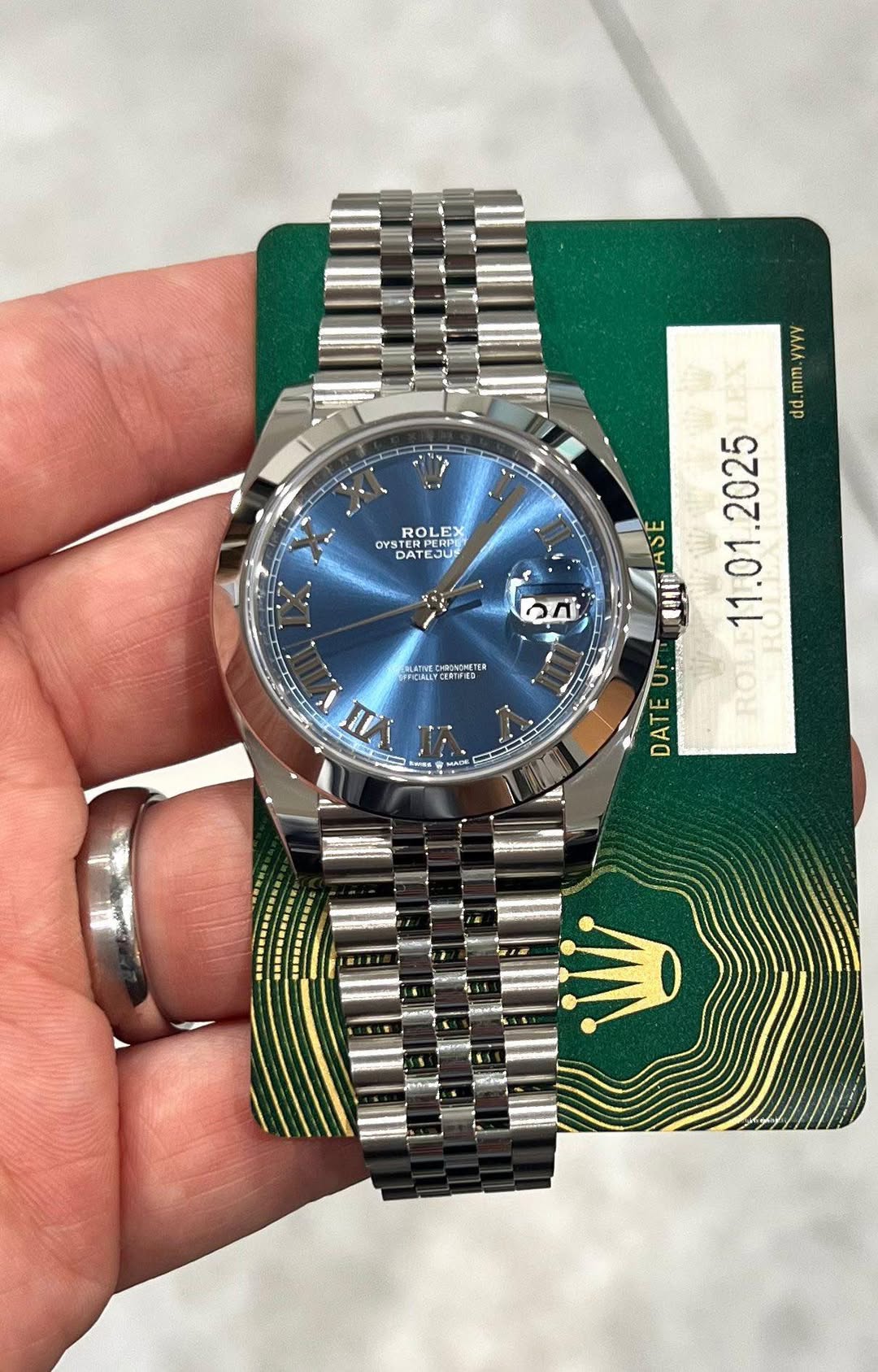 May be an image of wrist watch and text