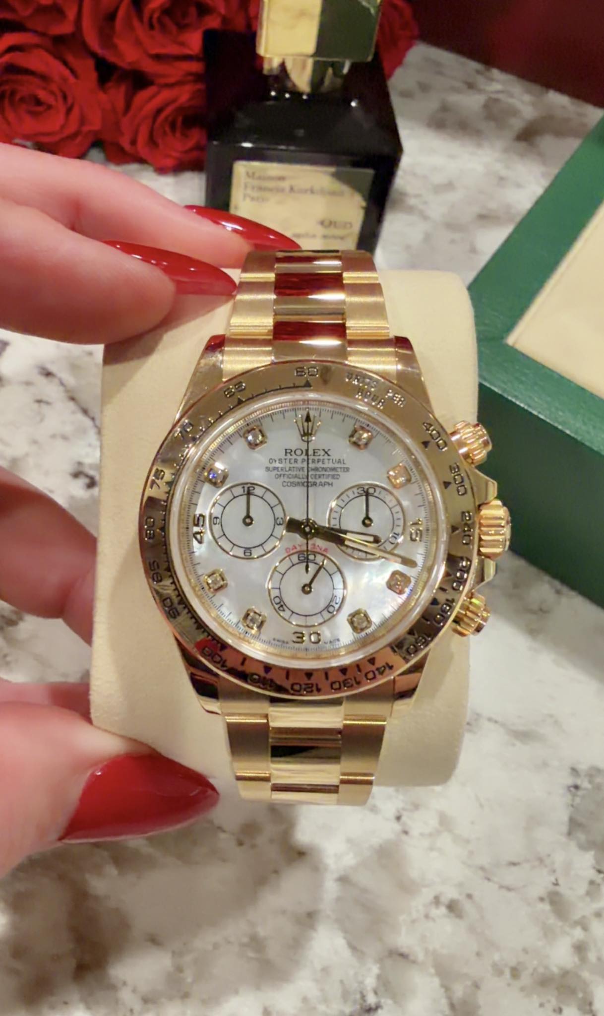 May be an image of wrist watch and text