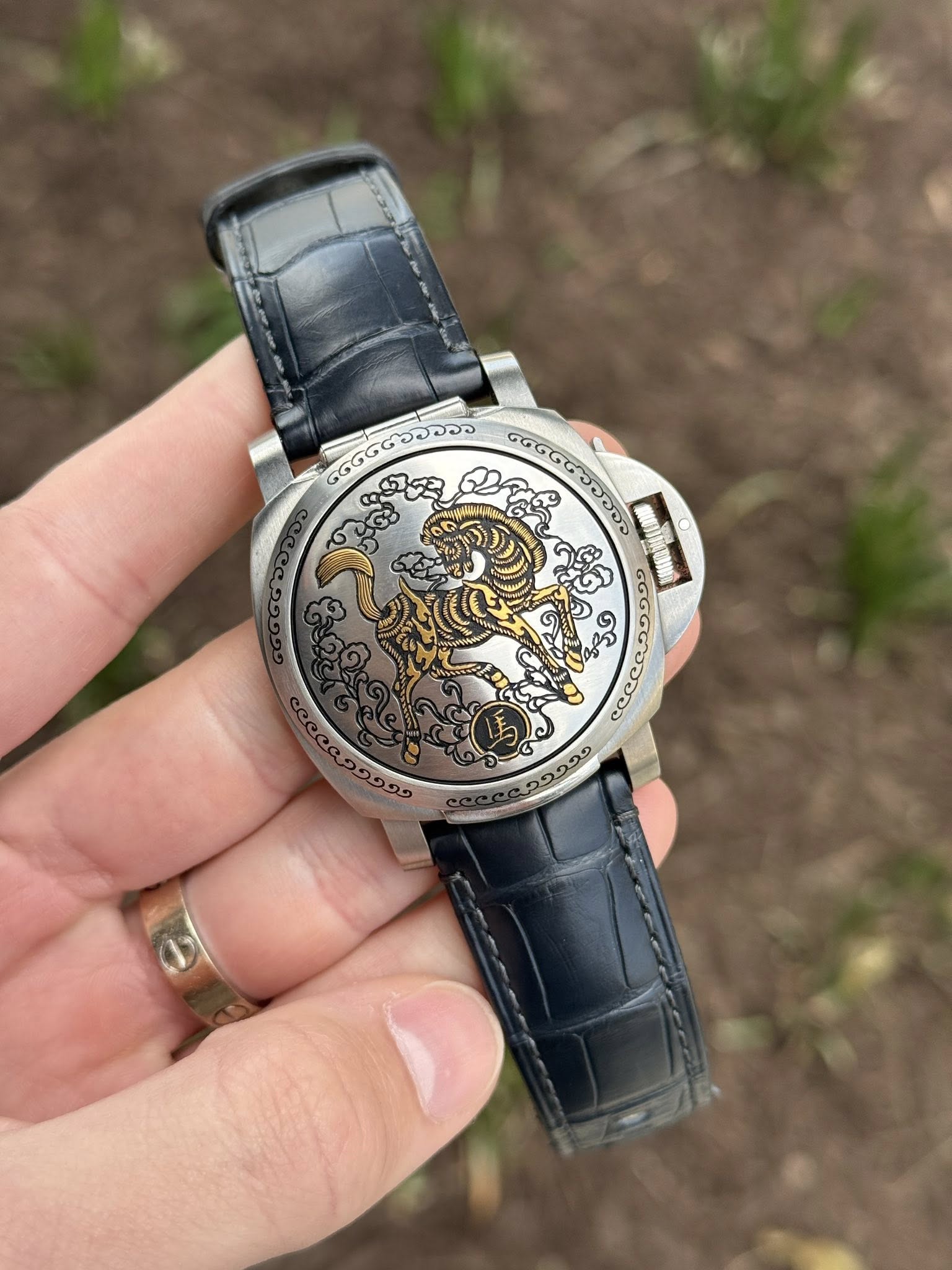 May be an image of wrist watch and text
