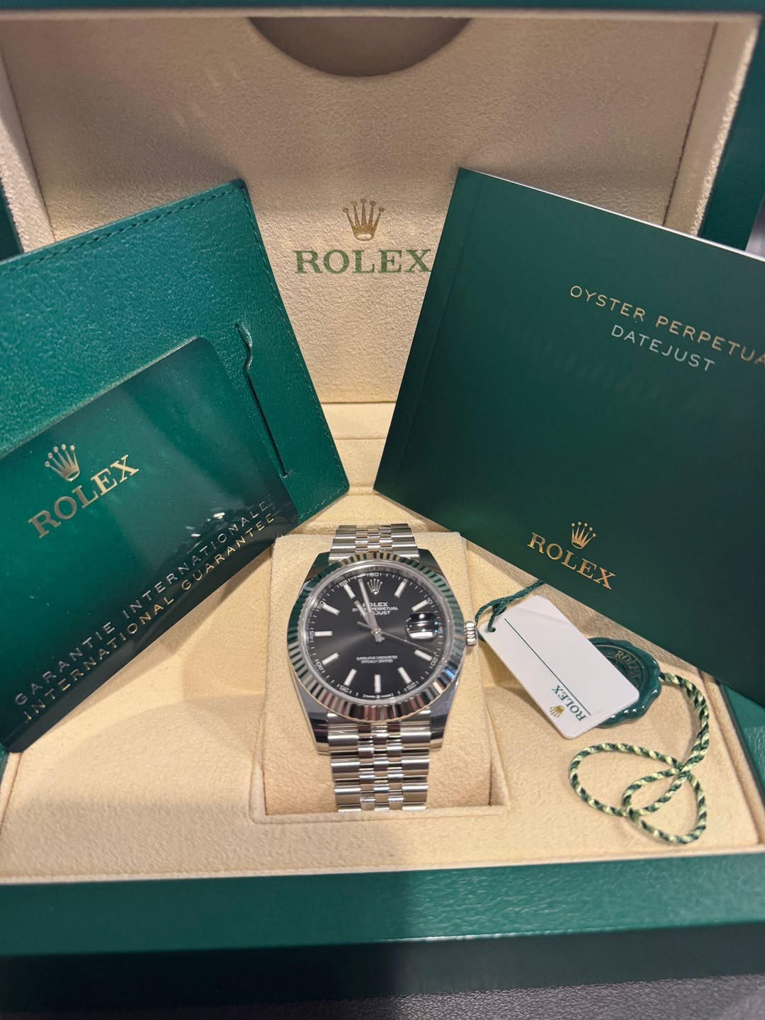 May be an image of wrist watch and text
