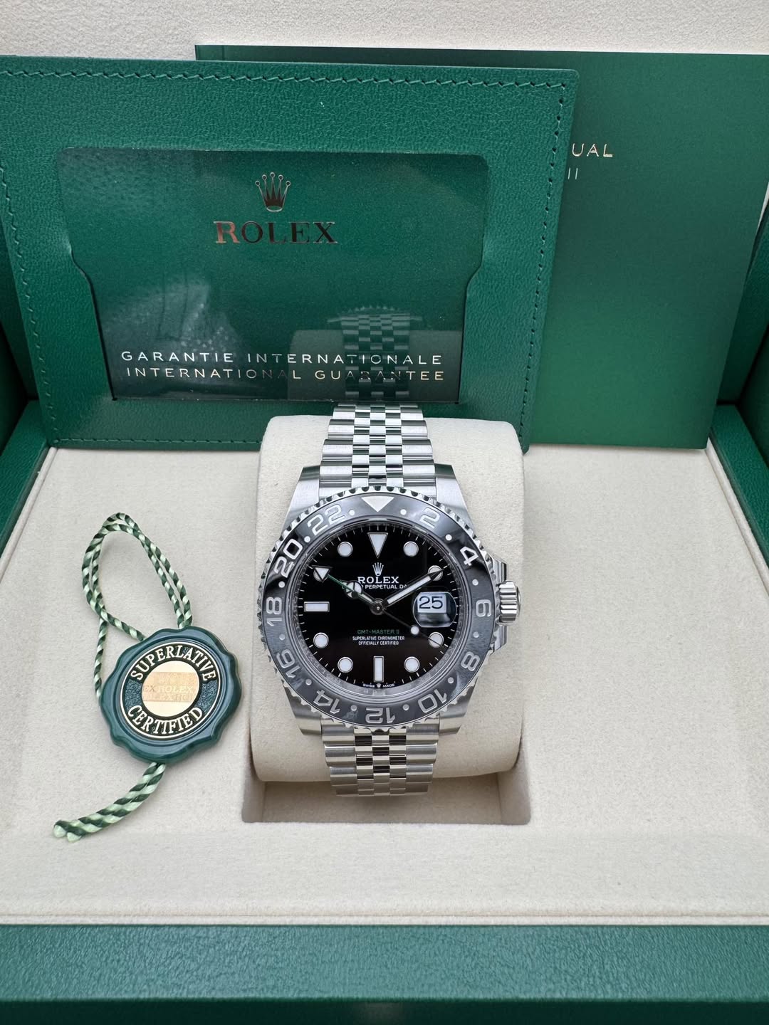 May be an image of wrist watch and text that says 'UAL L شری GARANTIE GARANTIEINTERNATONALE IN INTERNATIONALE TONALE INTERNATI LGUA: AHANTEE TE P ROLE ROLE prea ROLEX REX EX רח…