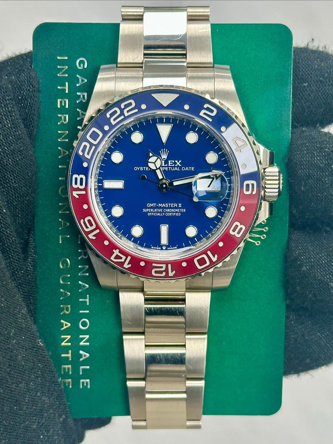 May be an image of wrist watch and text