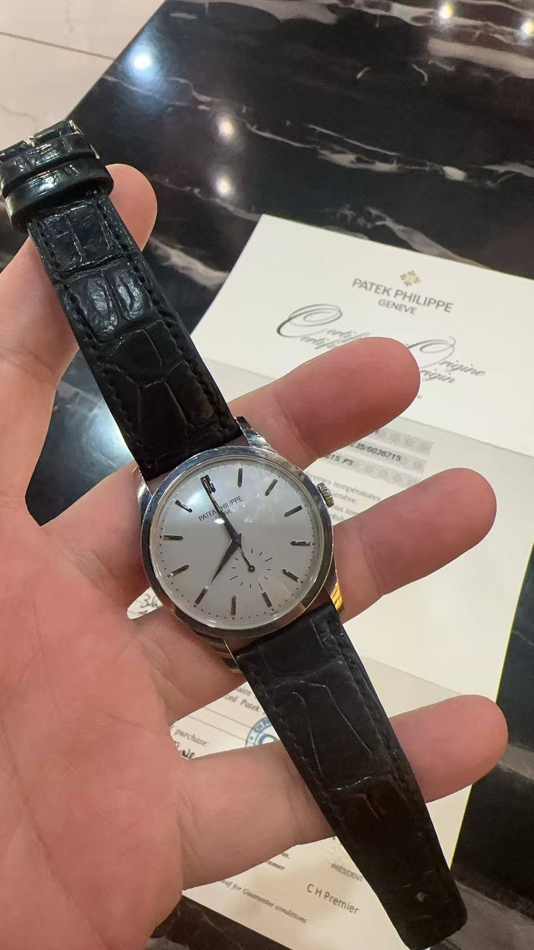 May be an image of wrist watch and text