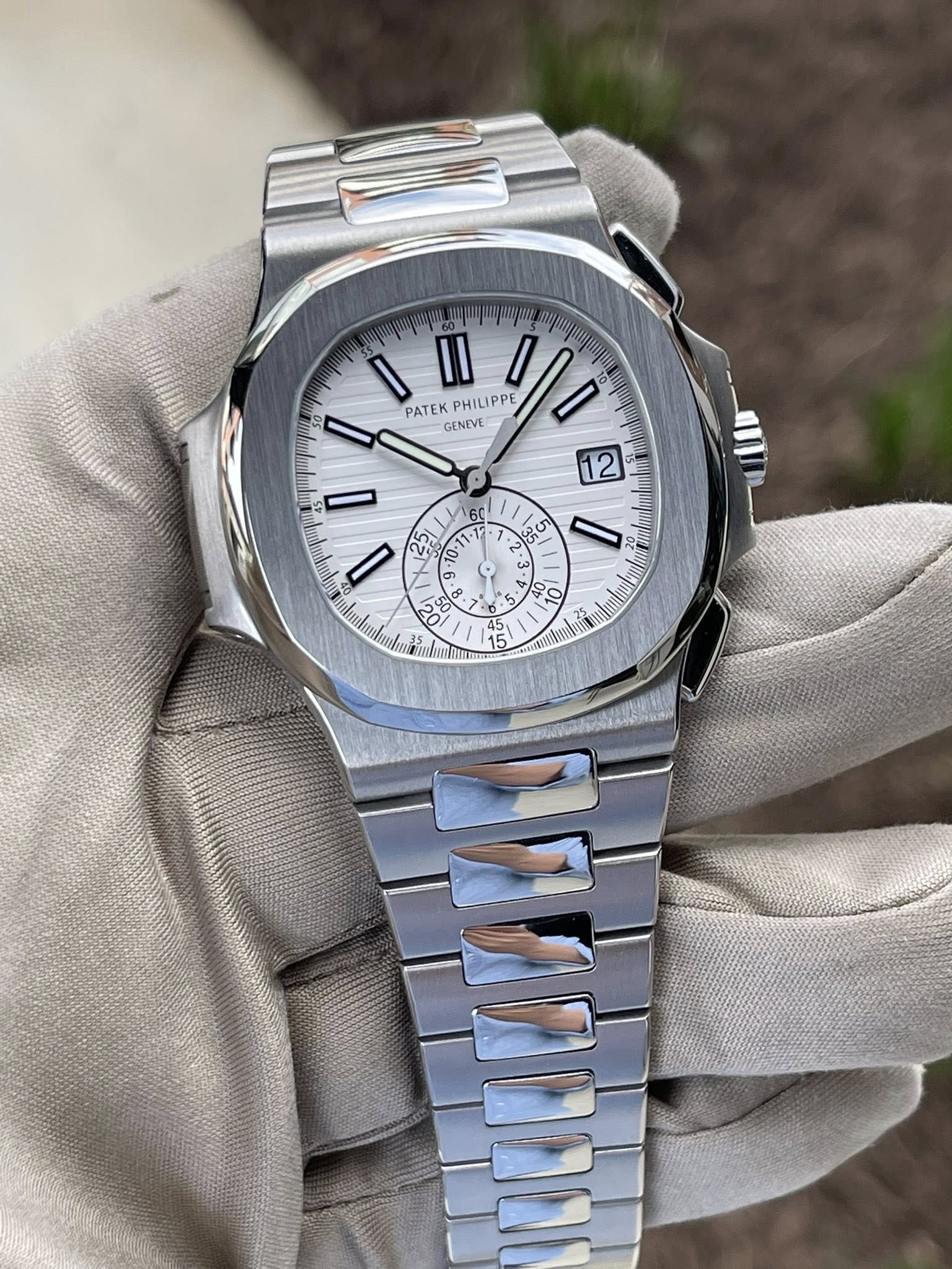 May be an image of wrist watch and text that says 'II PATEK PHILIPPE GENEVE LIPPE 0l0 12 I 60 17 g ١ ባን राष 10 -1 11 SO 20 O ac 8 8 ه 1 3 35 D : 3 و : A 09 40 5 I p'