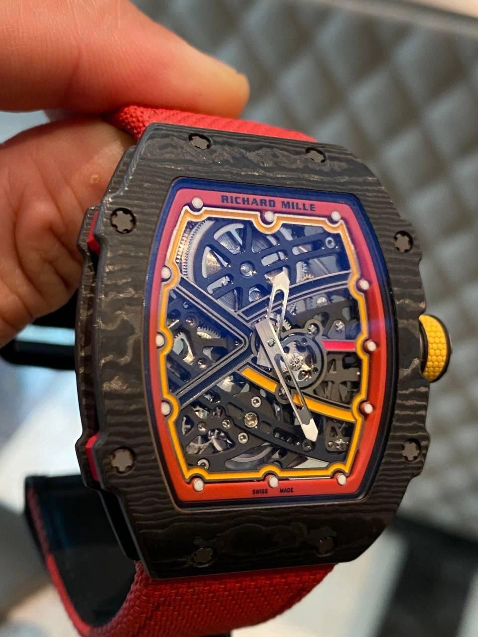 May be an image of wrist watch and text