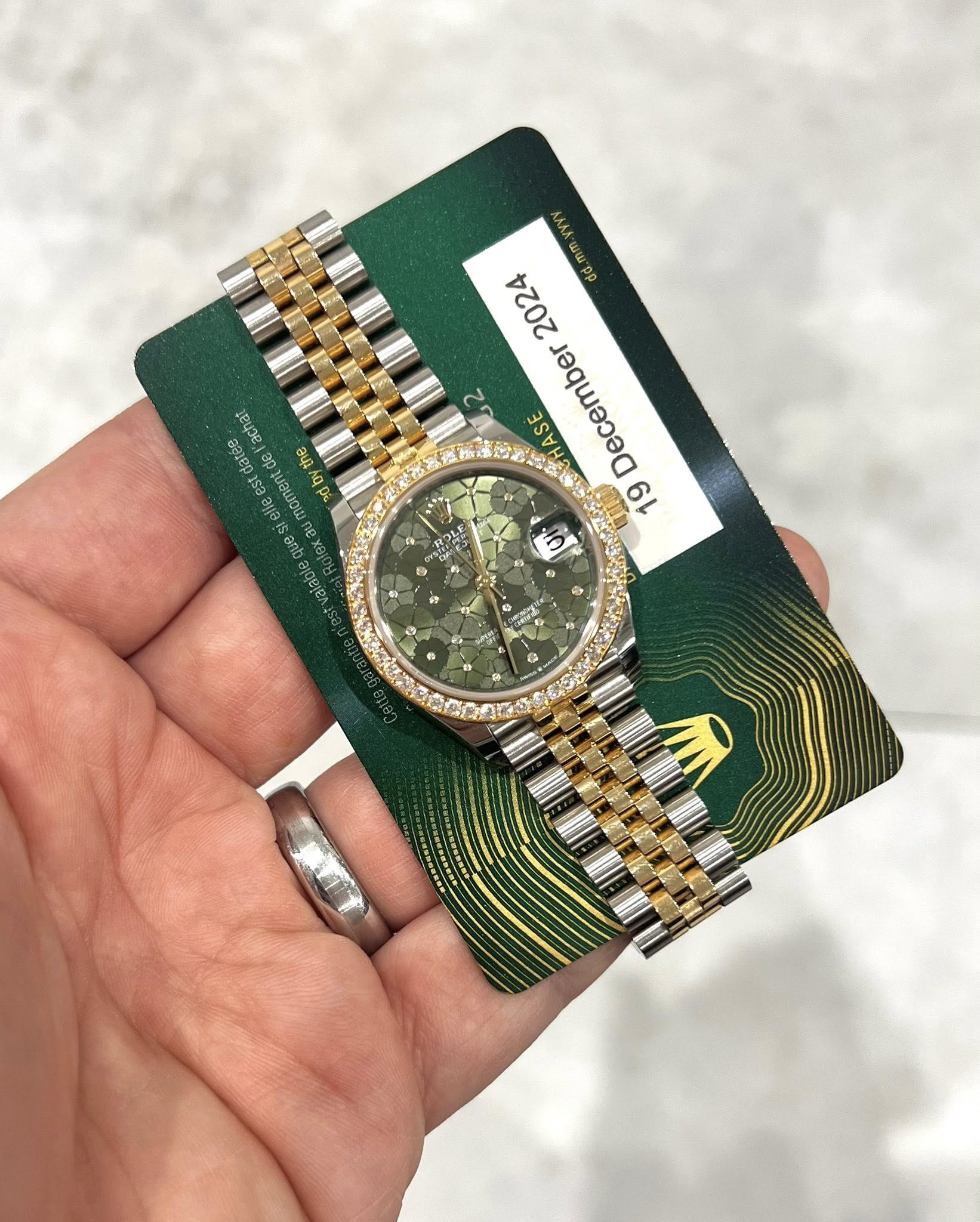 May be an image of wrist watch and text