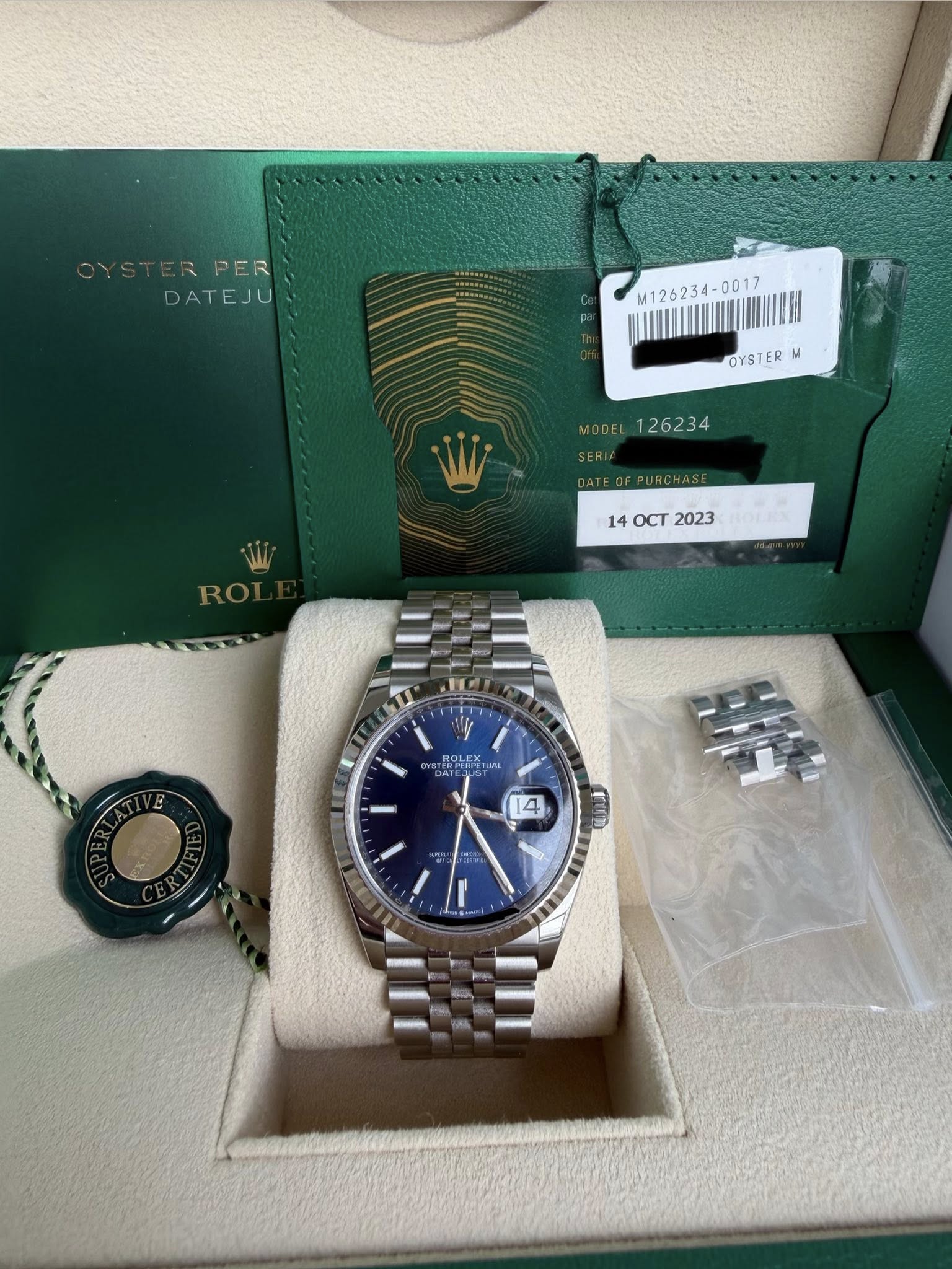 May be an image of wrist watch and text that says 'RPER PER DATEJU M126234- 0017 M126234-0017 00 OYSTER M MODEL 140CT2023 OCT 2023 ROLEX YURA U 14 D S 電込津 2 1'