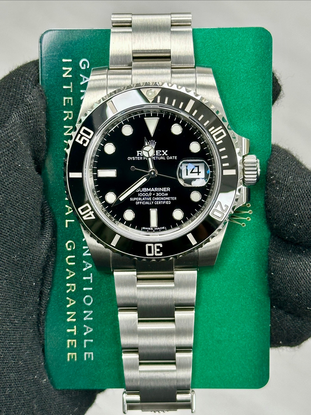 May be an image of wrist watch and text that says 'INTERN んん GAN 50 ا Mlir R OYSTERP EX ETUAL ETUALDATE DATE 10 14 SUBMARINER 1000/ CHRONDMETE TER OFFICIALLYCERTIFIE SMISS AA6…