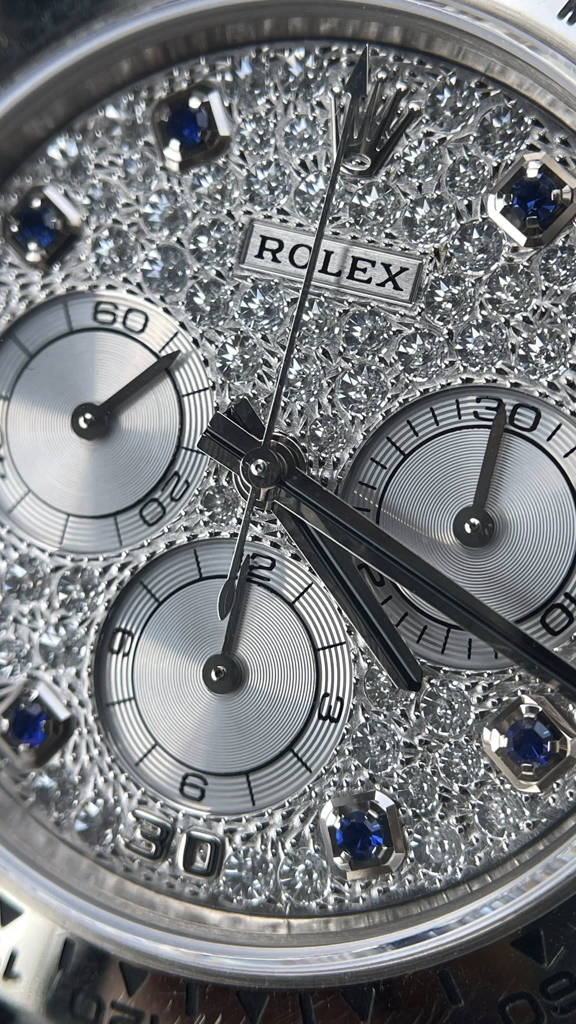 May be an image of wrist watch and text